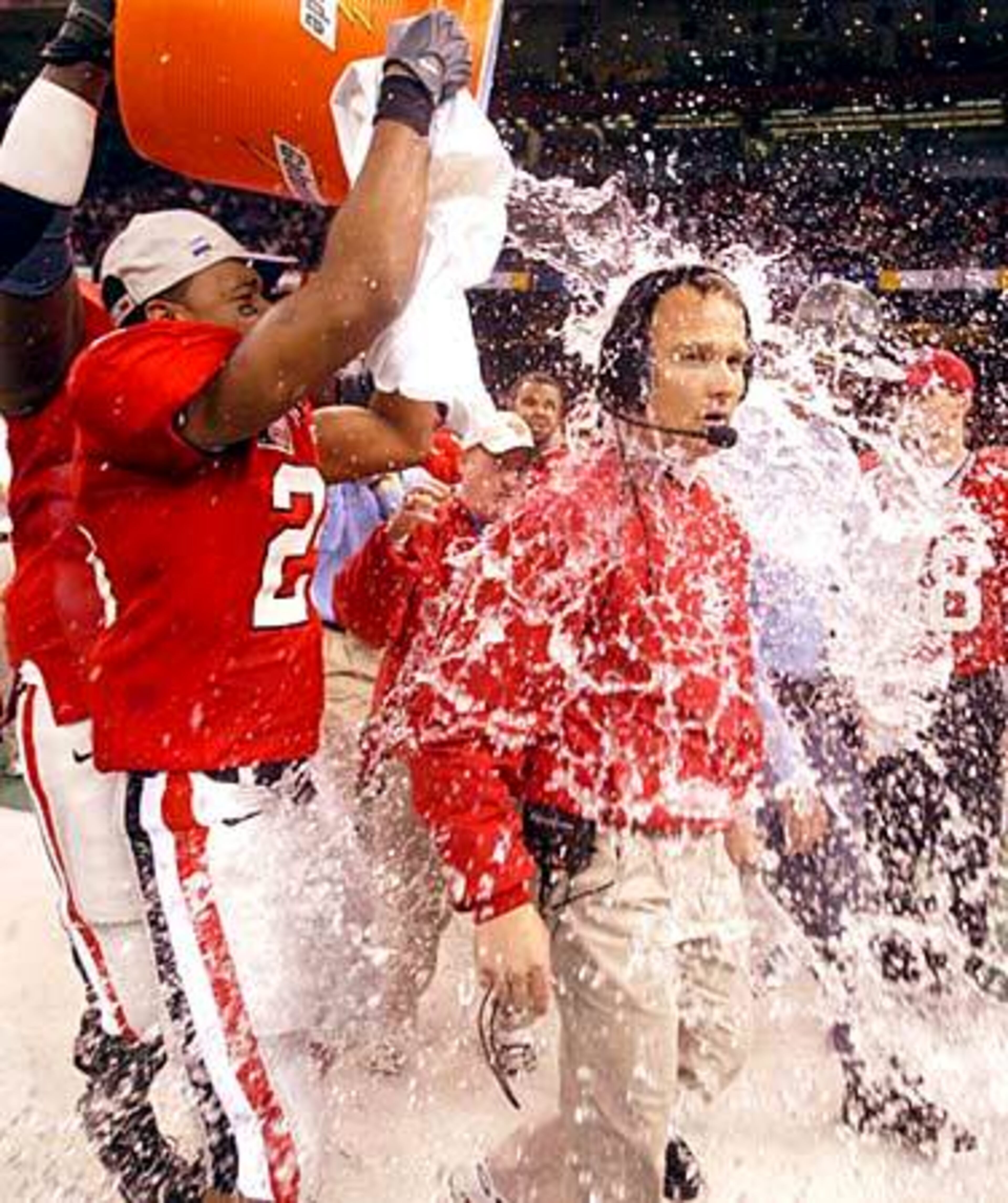 Michael Johnson douses Georgia head coach Mark Richt with celebratory cold water late in the fourth quarter of the 2003 Sugar Bowl. Georgia beat Florida State 26-13.