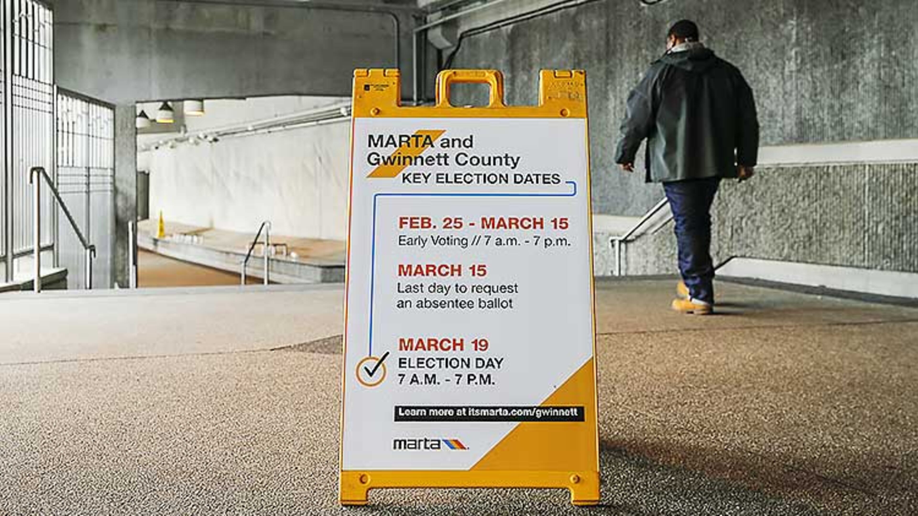 A sign indicating the MARTA and Gwinnett County transit referendum voting calendar is displayed at the Doraville MARTA Transit Station in Doraville.