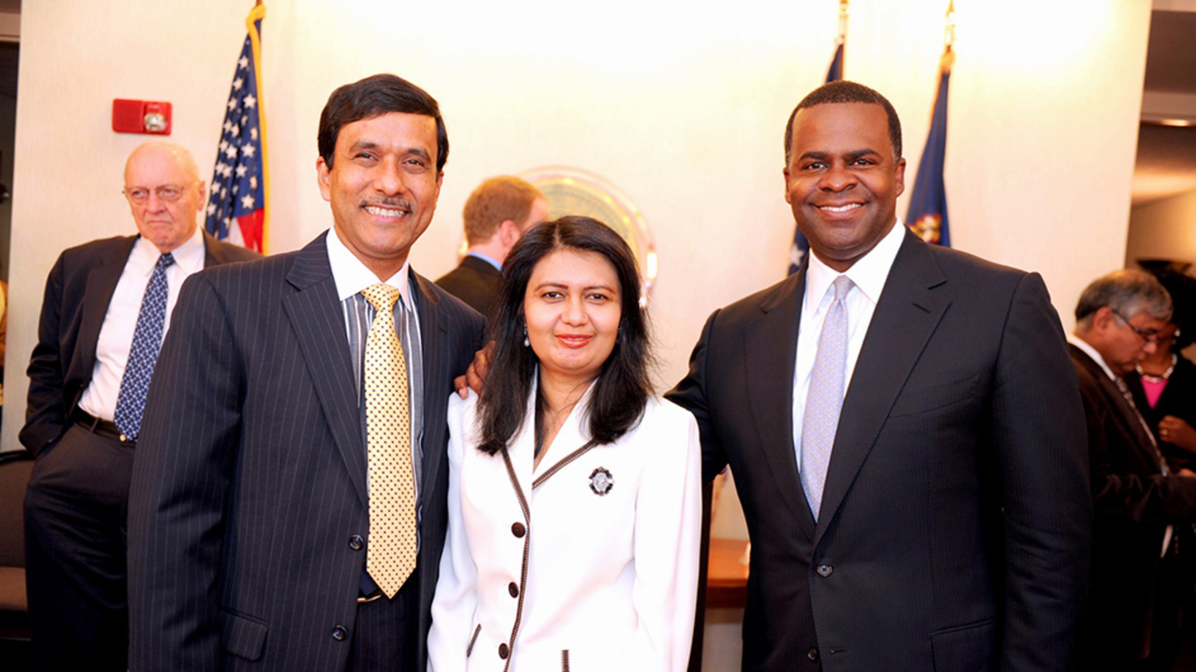 Mohammad Bhuiyan and his wife Shamima Amin, with Atlanta Mayor Kasim Reed (right). AJC file