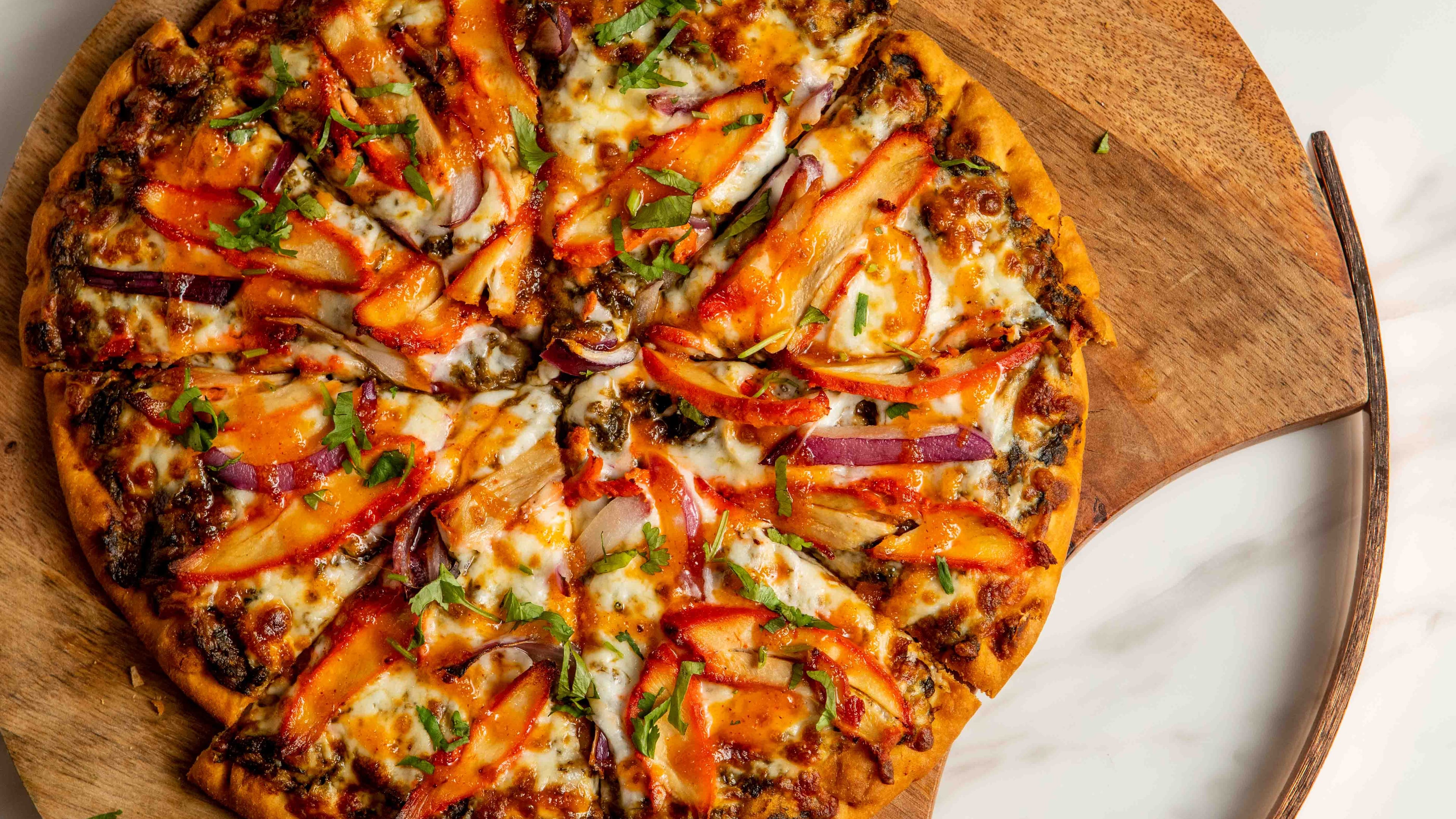 Chili paneer pizza is one of several Indian-inspired pizzas on the menu at Tandoori Pizza and Wings. / Courtesy of Tandoori Pizza and Wings