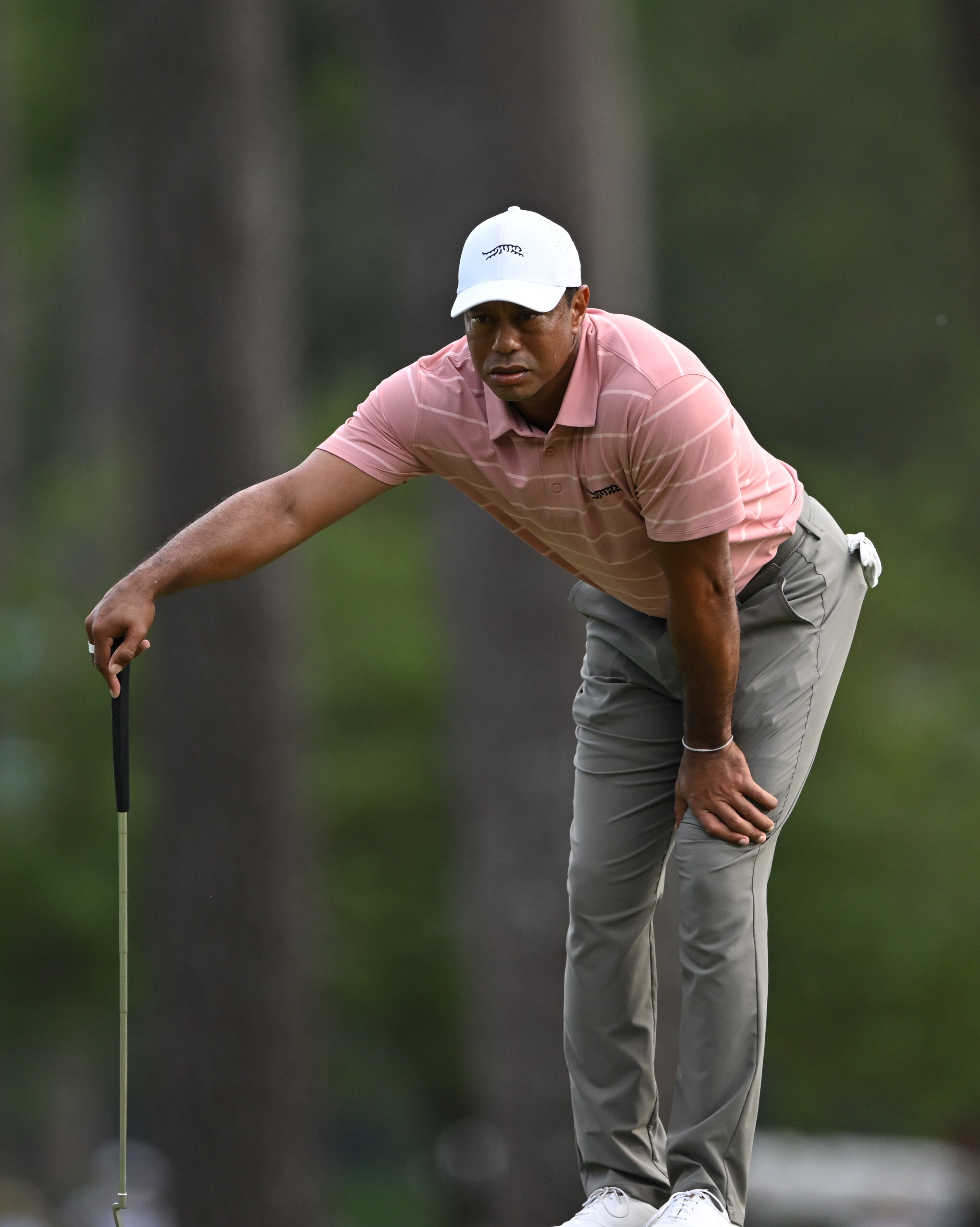 Tiger Woods lines up putt on third hole at the 2024 Masters Tournament at Augusta National Golf Club, Thursday, April 11, 2024, in Augusta, Ga. (Hyosub Shin / Hyosub.Shin@ajc.com)