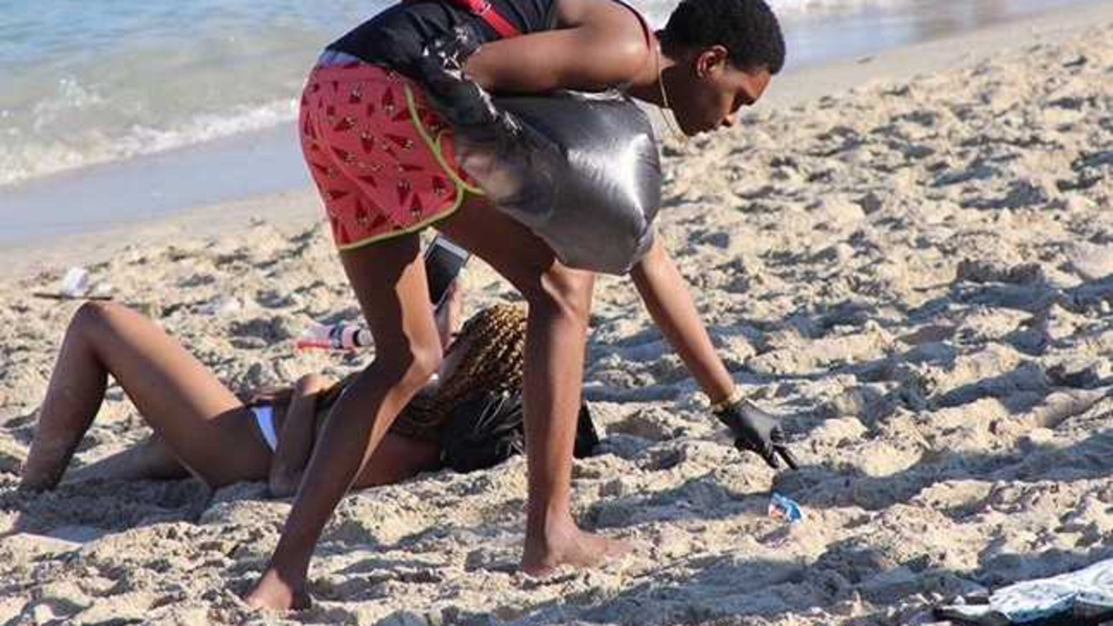 University of West Georgia student Joseph Caraway picks up trash up from people littering on Miami Beach. Caraway voluntarily picked up the trash during a Spring Break visit to the beach. Caraway, 19, said he's studying biology and strongly believes in caring for the environment. PHOTO CONTRIBUTED.