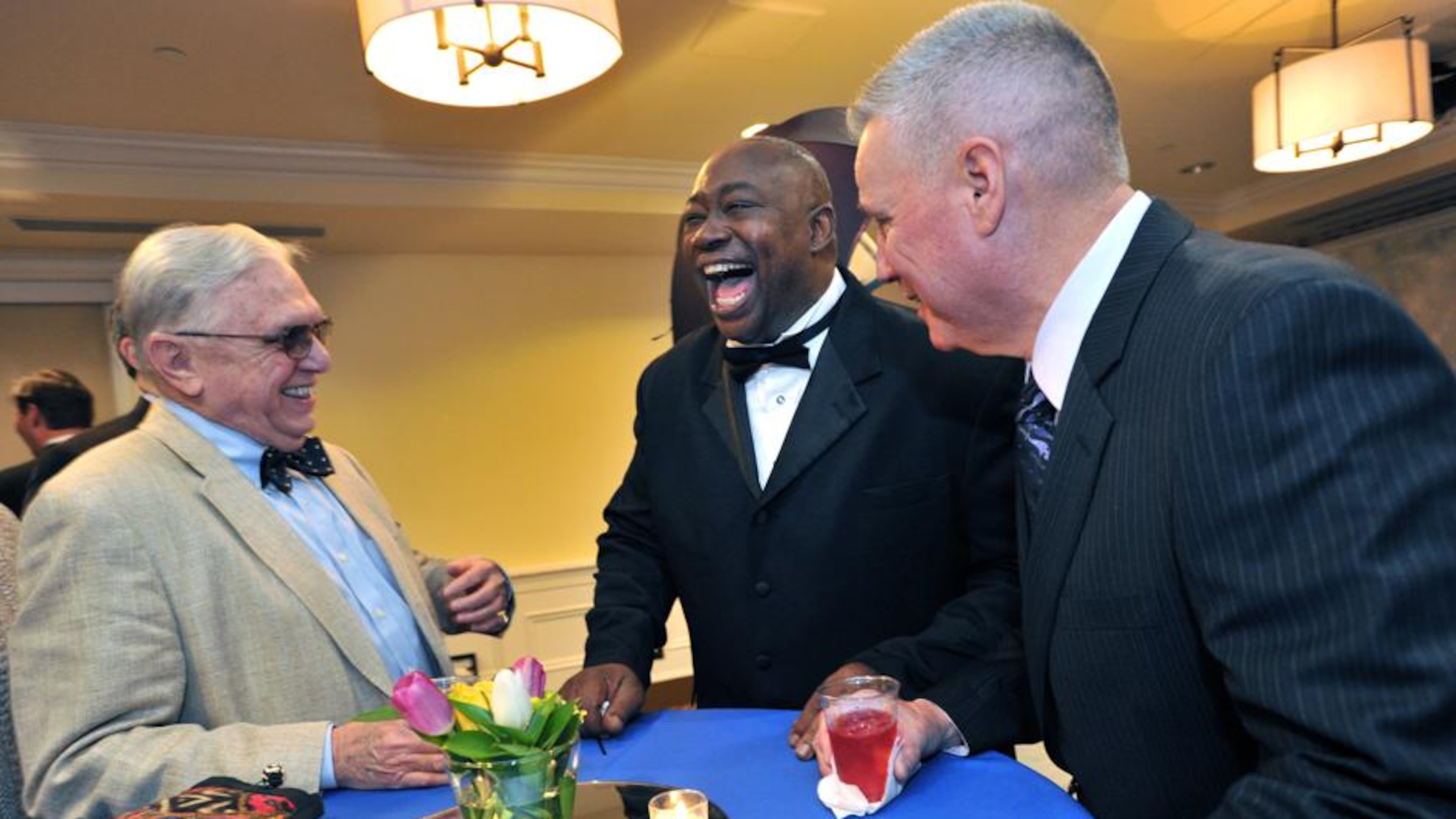 2014 Inductee George Rogers (center) talks with guests Bill Knox (left) and Frank Boyd before the Atlanta Sports Hall of Fame 10th Anniversary induction ceremony at Buckhead Theater in Atlanta on Friday, February 7, 2014. HYOSUB SHIN / HSHIN@AJC.COM