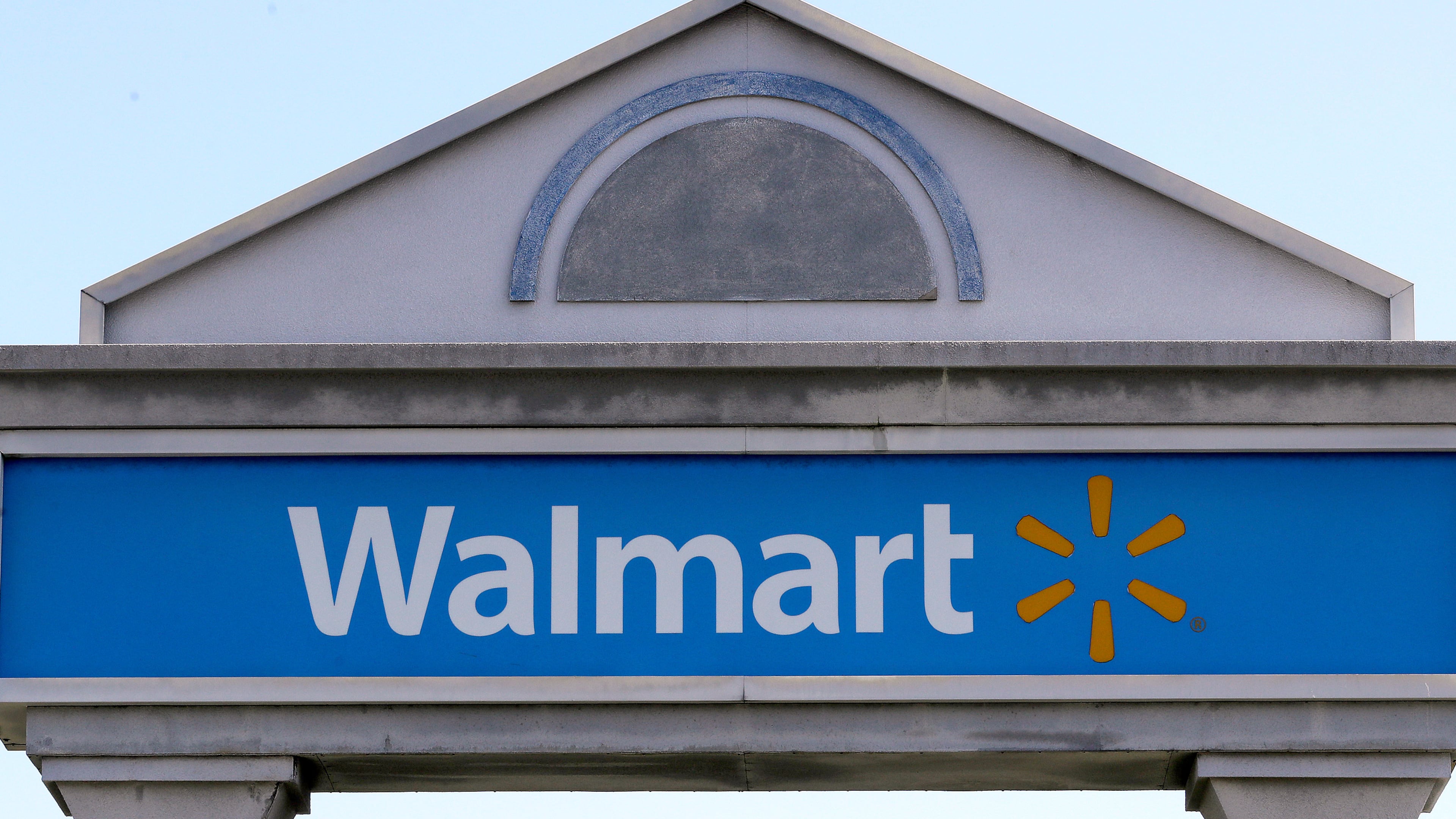 FILE - A Walmart sign stands outside a store, Sept. 3, 2019, in Walpole, Mass. (AP Photo/Steven Senne, File)
