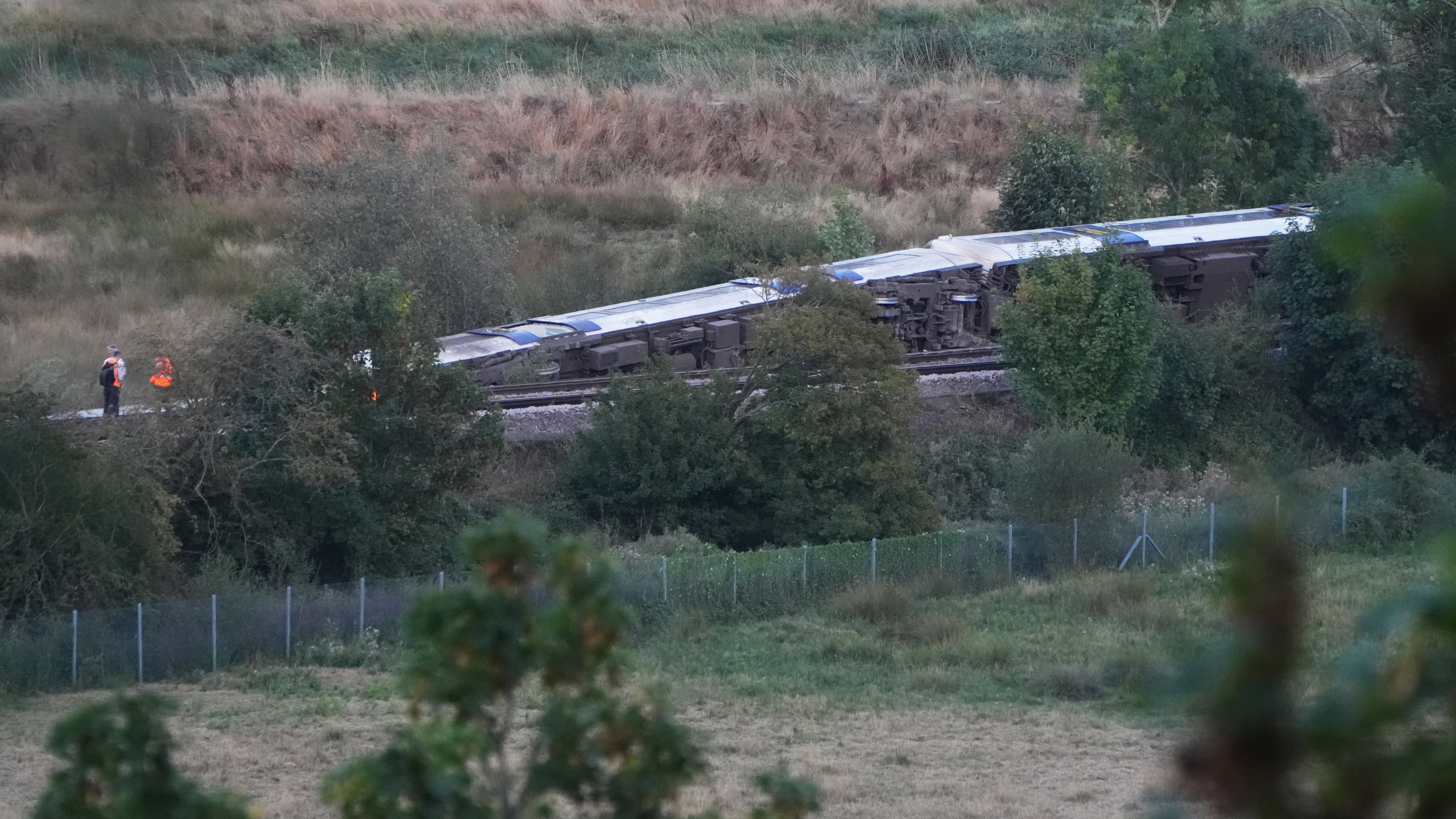A train with around 150 people aboard derailed near the Lewes, England, railway station in East Sussex on Thursday, Aug. 13, 2026. (Jonathan Brady/PA via AP)