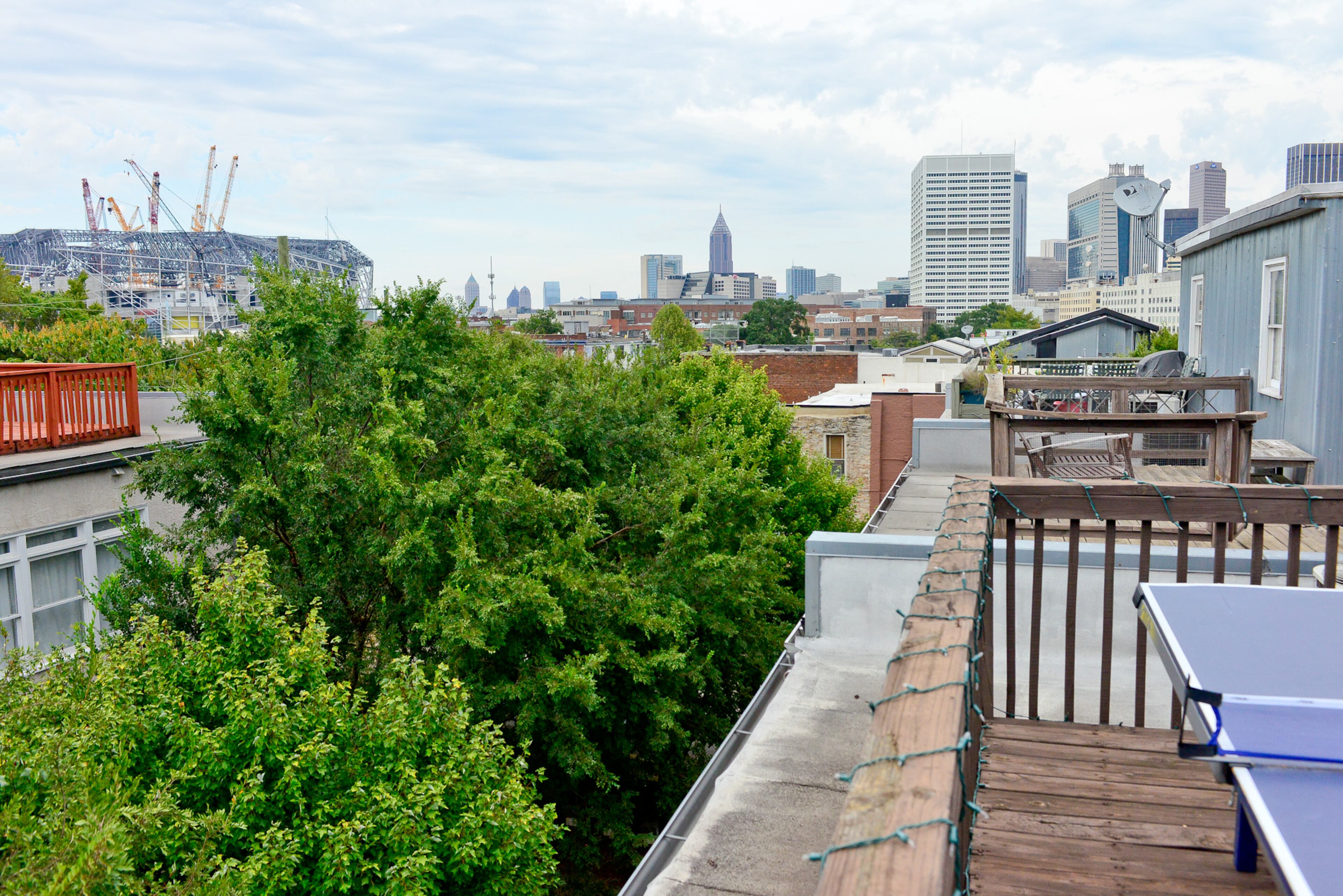 Since moving in to their Castleberry Hill loft, the couple have watched the Falcons' new Mercedes-Benz Stadium rise over the treetops nearby.