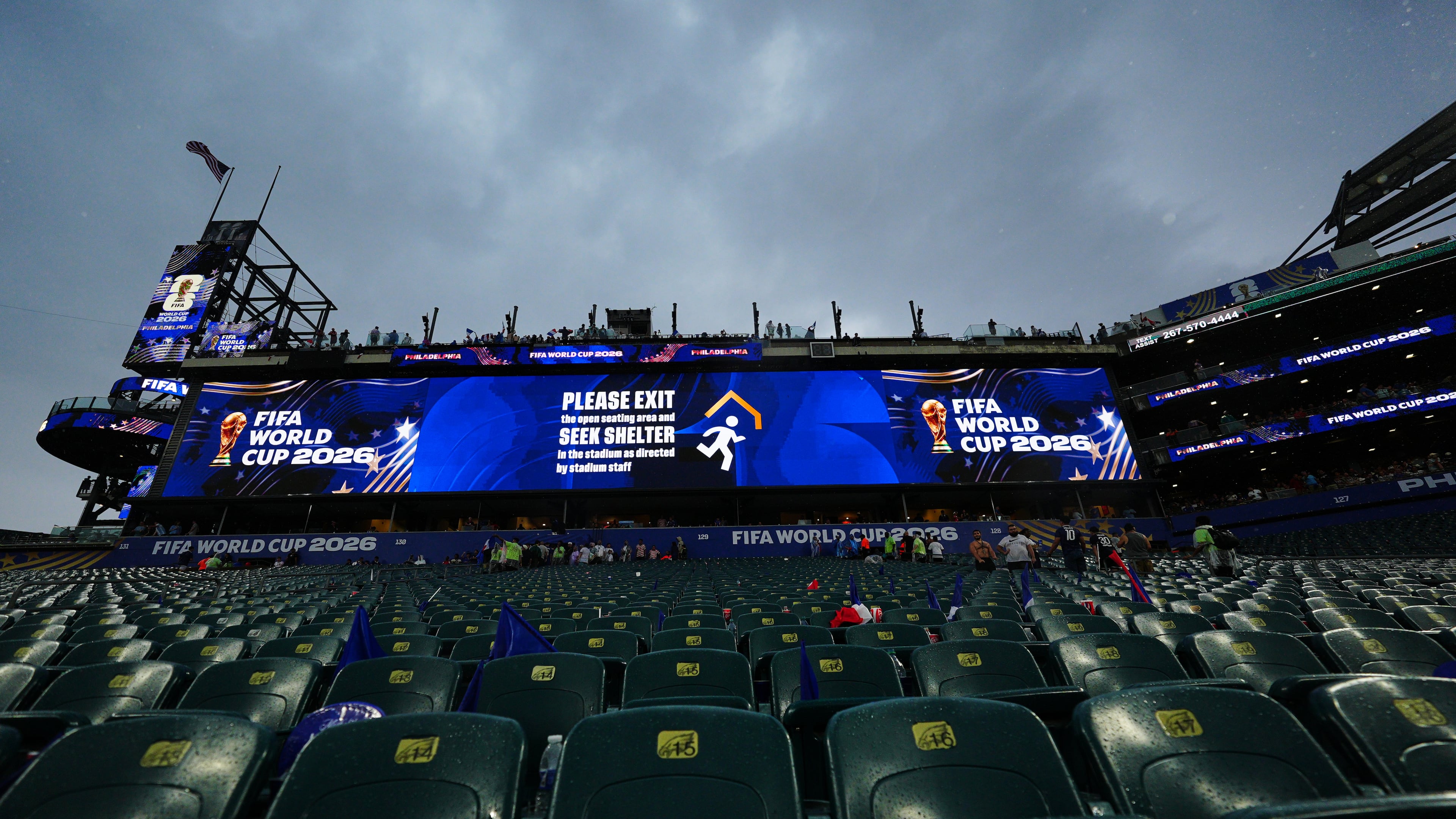 A sign advising fans of a weather delay is displayed during the World Cup Group I soccer match between France and Iraq in Philadelphia, Monday, June 22, 2026. (AP Photo/Derik Hamilton)