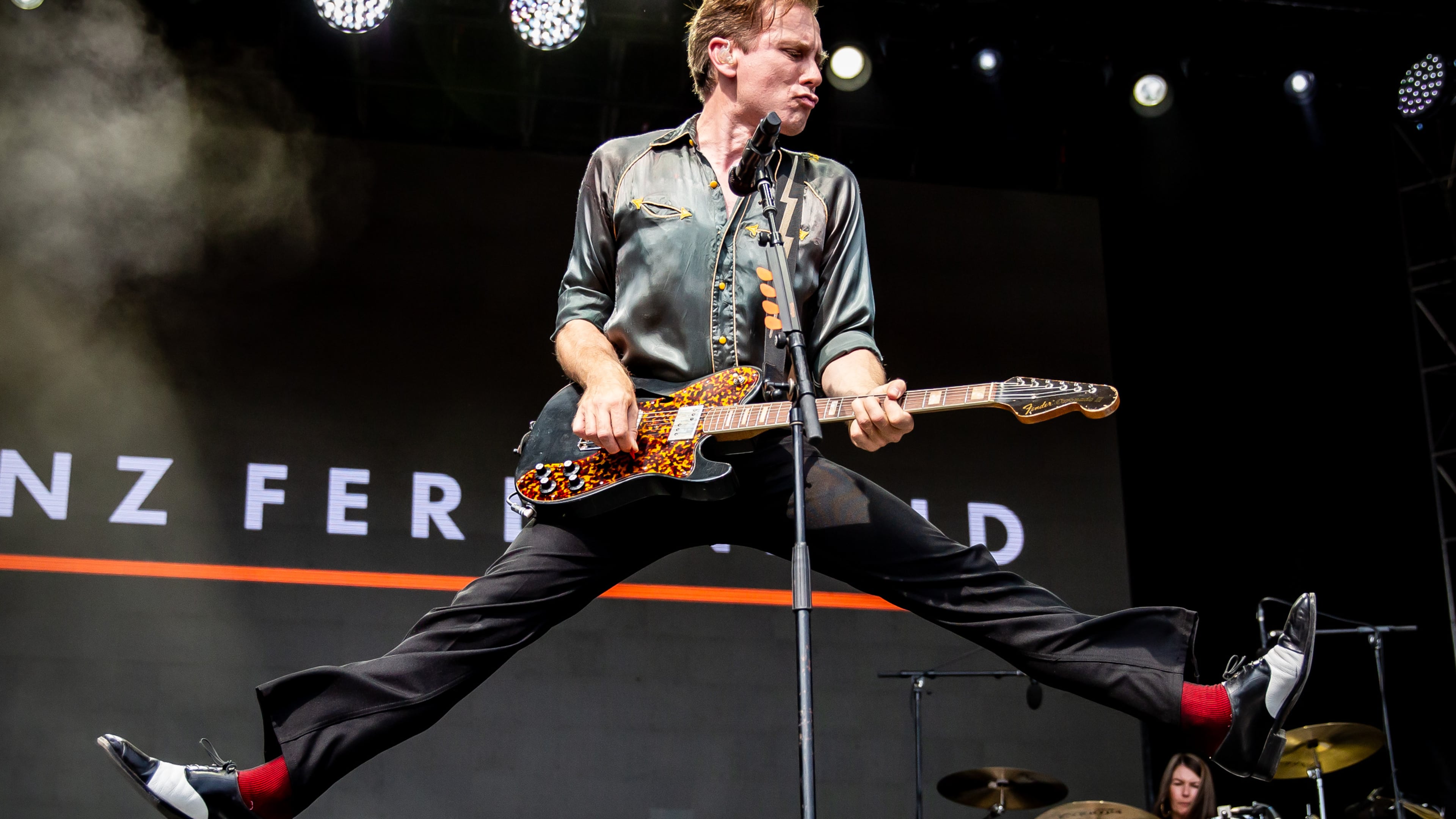 Franz Ferdinand frontman Alex Kapranos jumped around in 90 degree heat, and the Scottish band played a sizzling set of hits and other cuts from its deep catalog at the Shaky Knees Music Festival in Piedmont Park in September 2025. (Ryan Fleisher for the AJC)