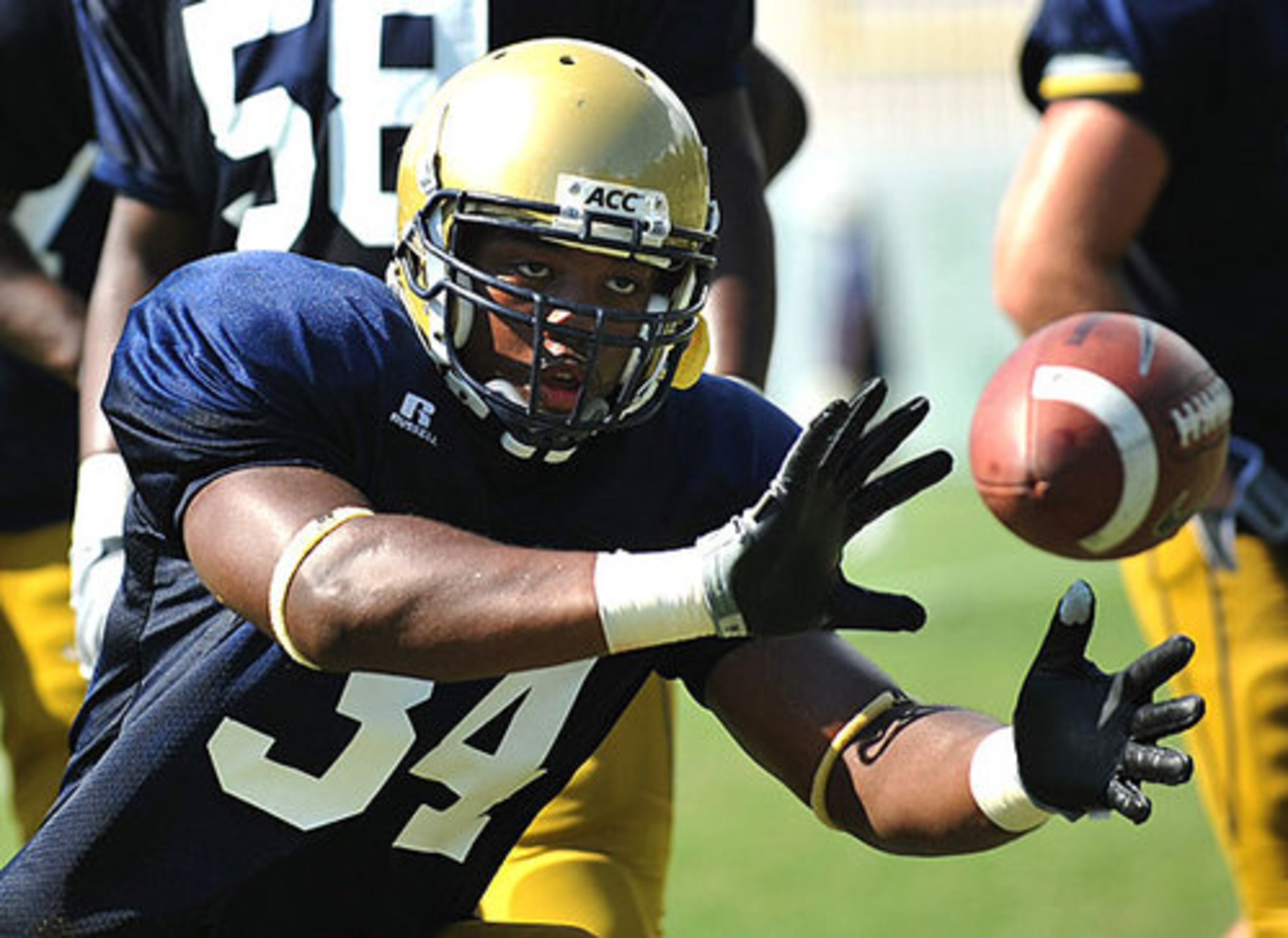 Georgia Tech receiver Steven Sylvester keeps his eyes on the ball.