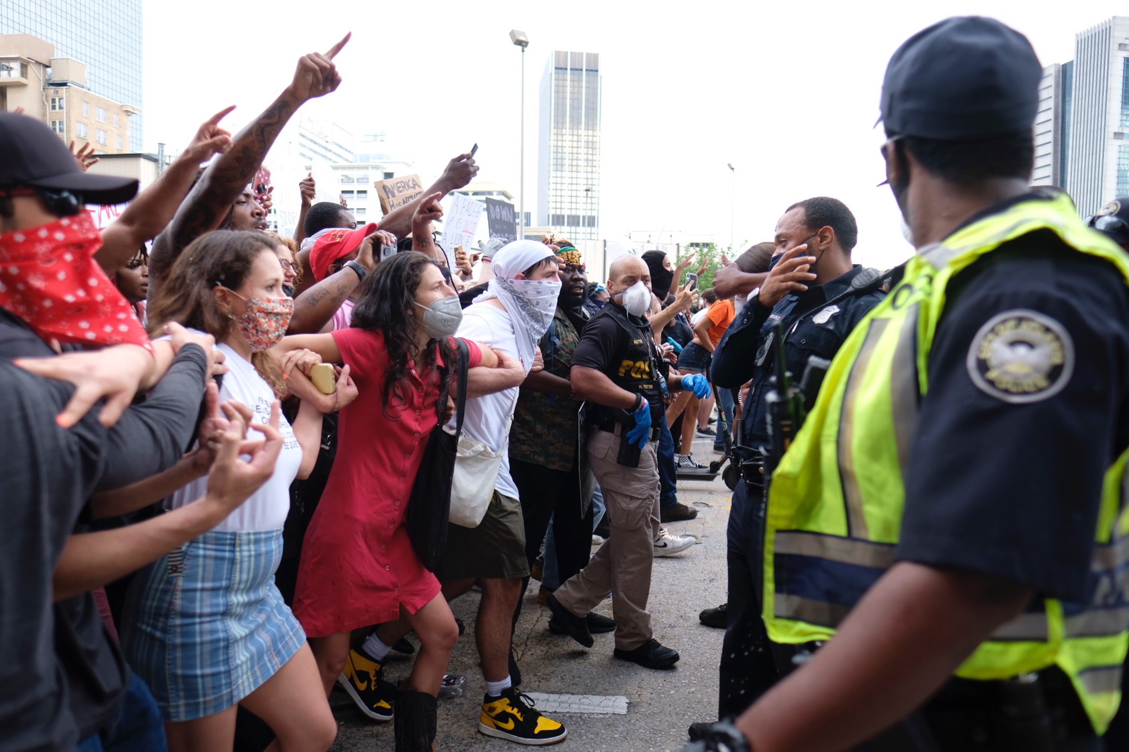 May 29, 2020 - Atlanta - After a peaceful march the Georgia State Capitol that swelled into the hundreds, protestors returned to the area around the Centennial Olympic Park and CNN center where some confronted police, who sprayed some demonstrators with pepper spray. They carried signs and chanted their messages of outrage over the death of George Floyd in Minneapolis.