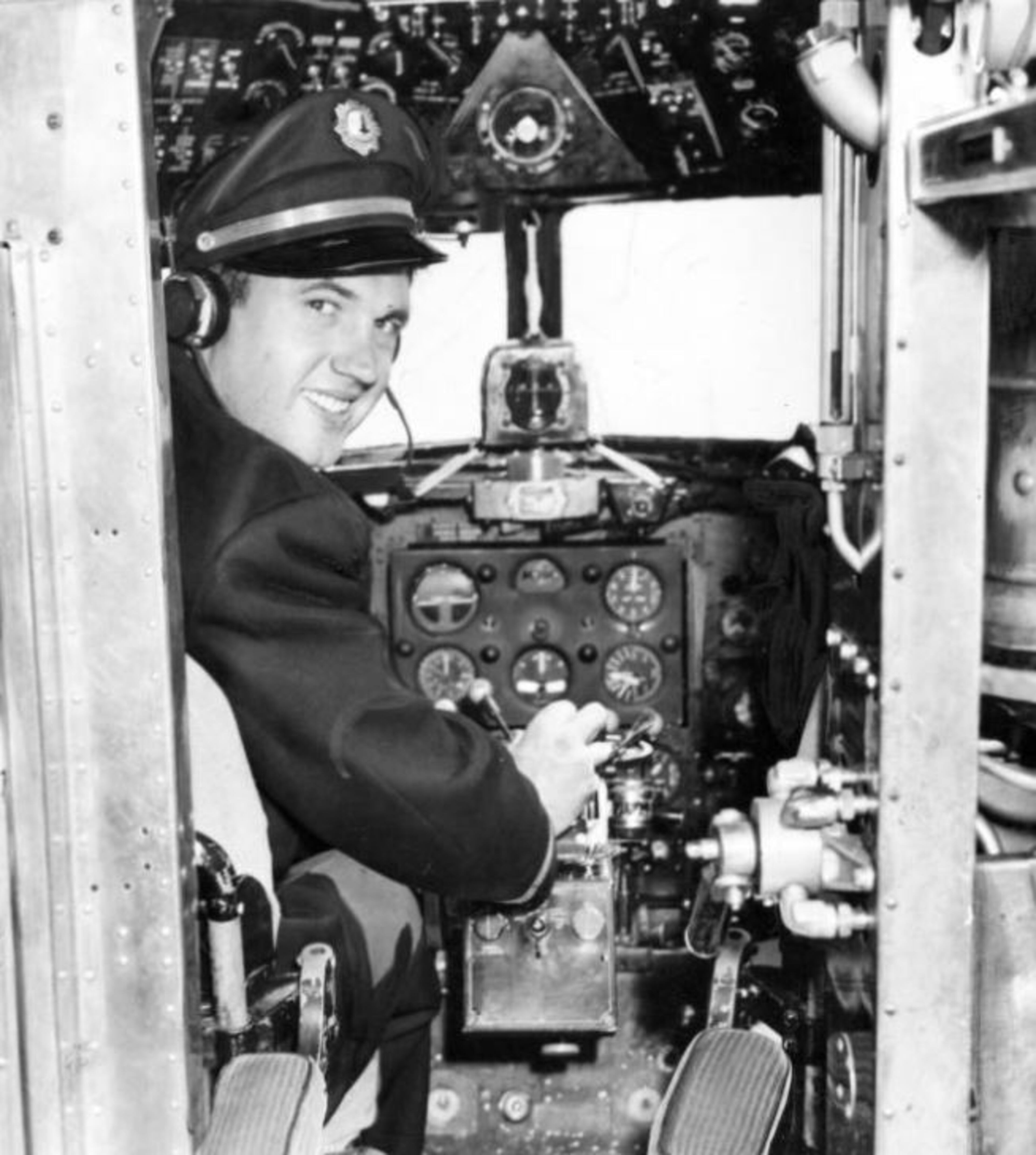Oct. 8, 1944 -- Pilot Johnny Bulla gets set up in the cockpit of the Eastern Air Lines plane he flies between Atlanta and Chicago. AJC PHOTO ARCHIVES