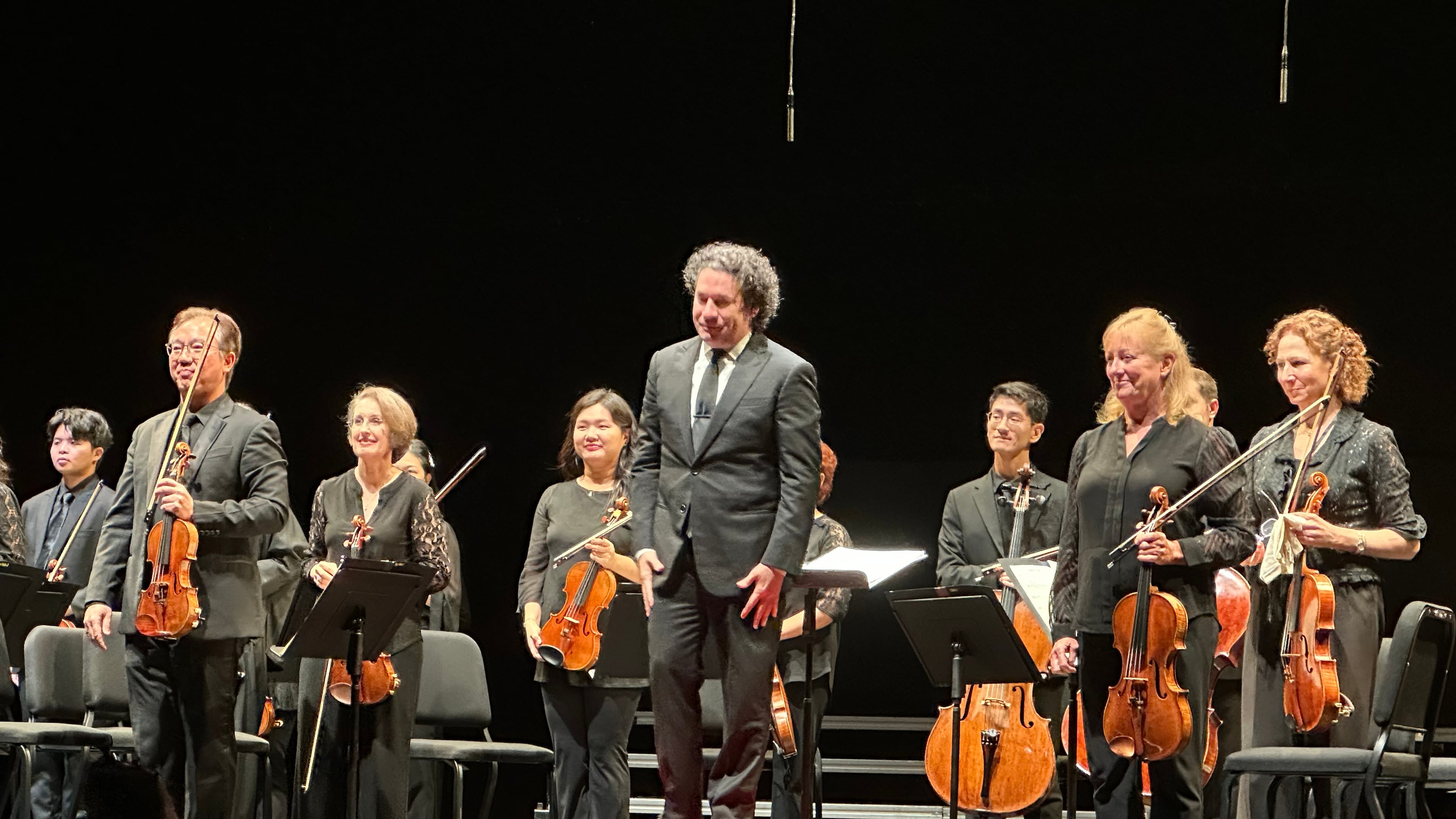 Gustavo Dudamel appears with the New York Philharmonic at a Sounds of Remembrance concert to commemorate the 25th anniversary of the 9/11 attacks at the Perelman Performing Arts Center in New York on Sept. 11, 2026. (AP Photo/Ron Blum)