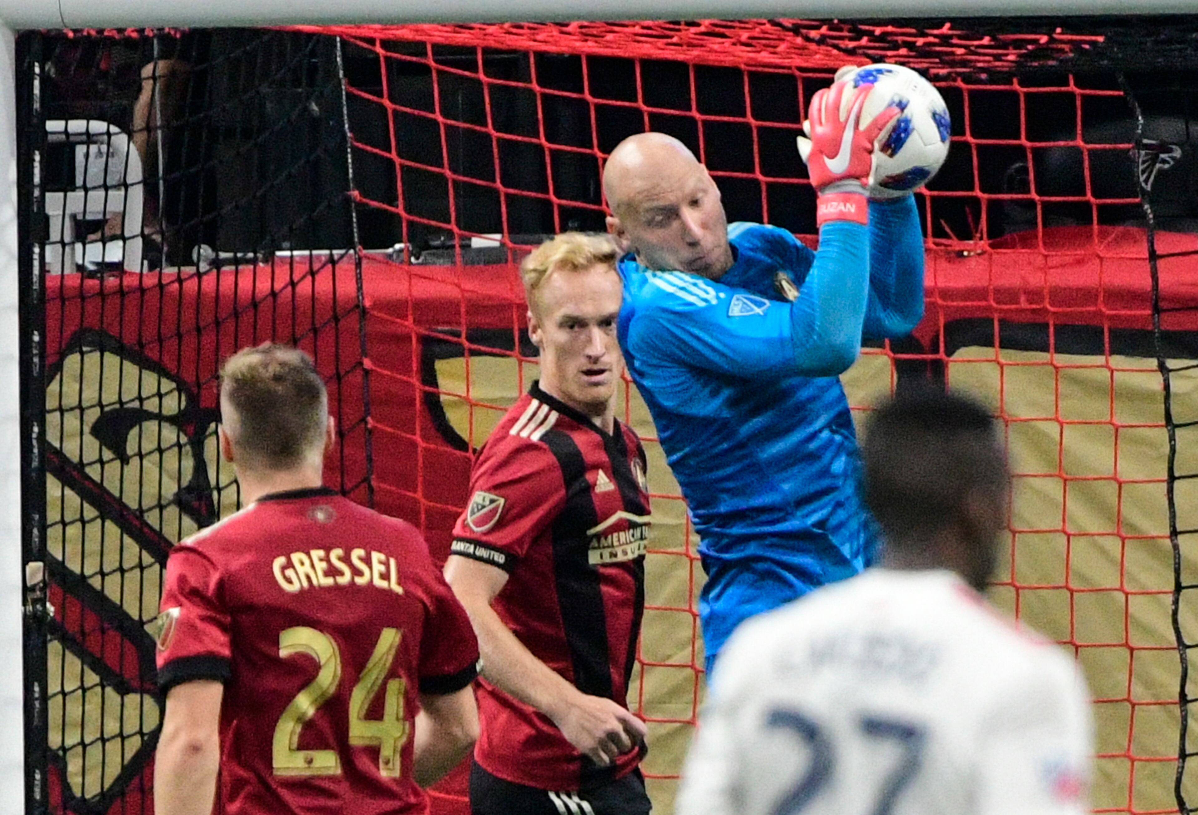 Atlanta United goalkeeper Brad Guzan makes a save during the second half of an MLS soccer game against the New England Revolution, Saturday, Oct. 6, 2018. (John Amis)