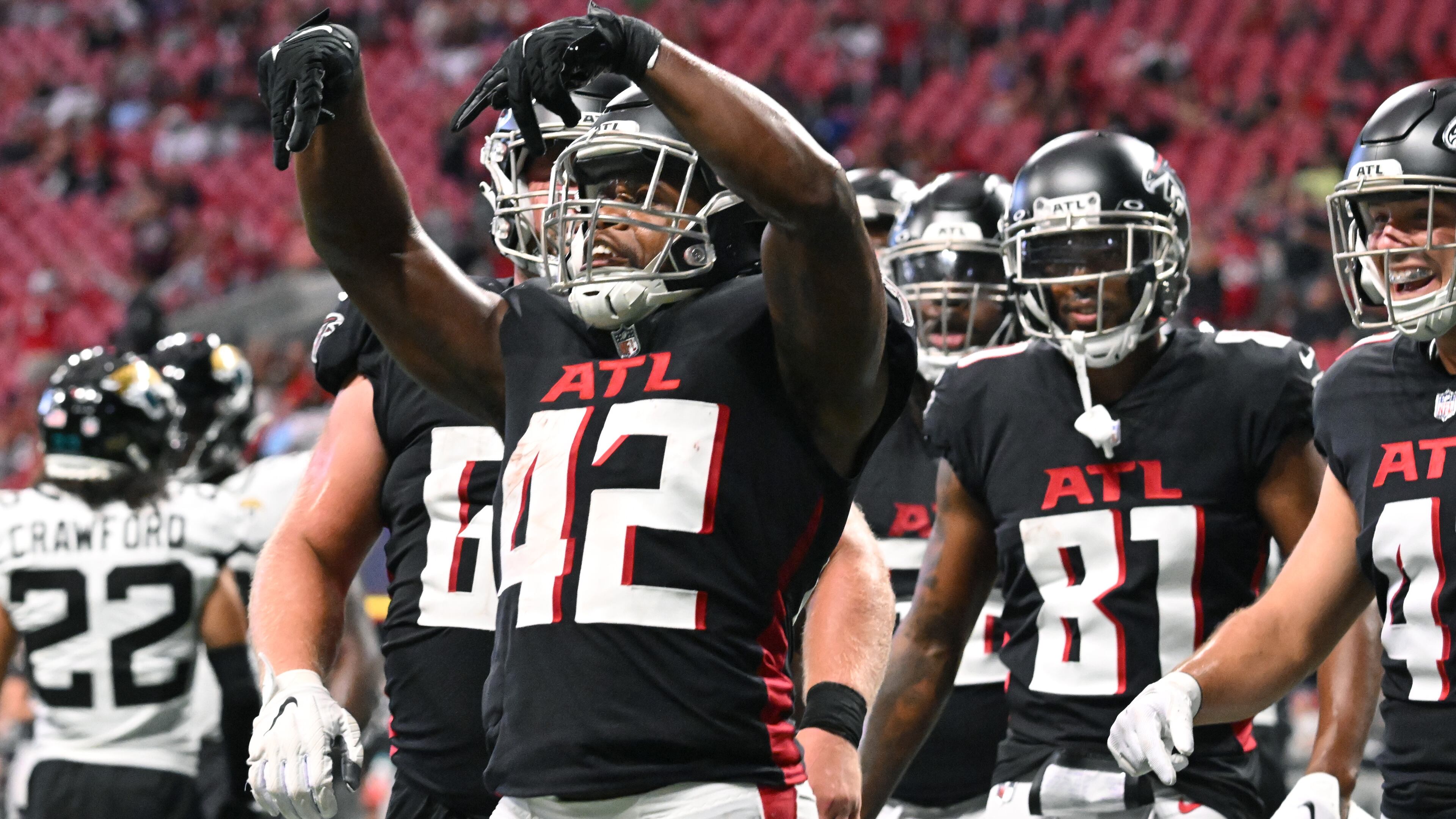 Falcons running back Caleb Huntley (42) celebrates after scoring a touchdown during the final exhibition game of the preseason at Mercedes-Benz Stadium in Atlanta at on Saturday, August 27, 2022. (Hyosub Shin / Hyosub.Shin@ajc.com)