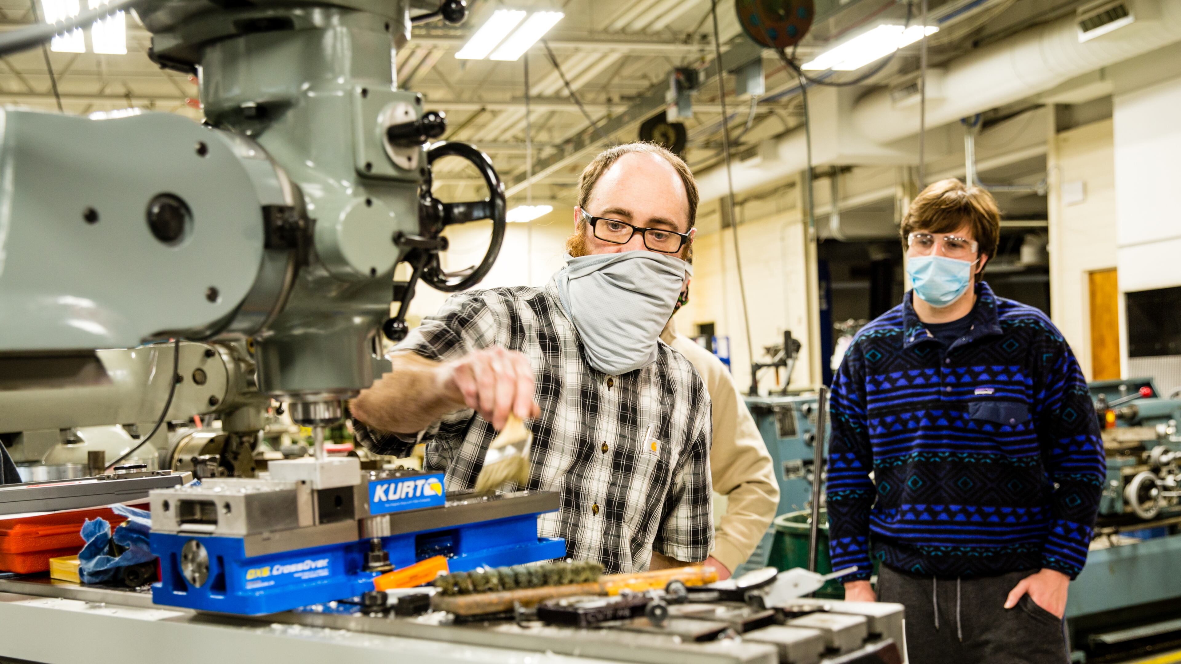 Georgia Northwestern Technical College in Rome, GA continues conducting classes, including precision machining and manufacturing labs, with smaller groups to allow for COVID-19 social distancing and with remote learning when possible Tuesday, Jan 26, 2021. Instructor Bart Jenkins demonstrates a few basics for a class of new students including Trey Prater, right. (Jenni Girtman for The Atlanta Journal-Constitution)
