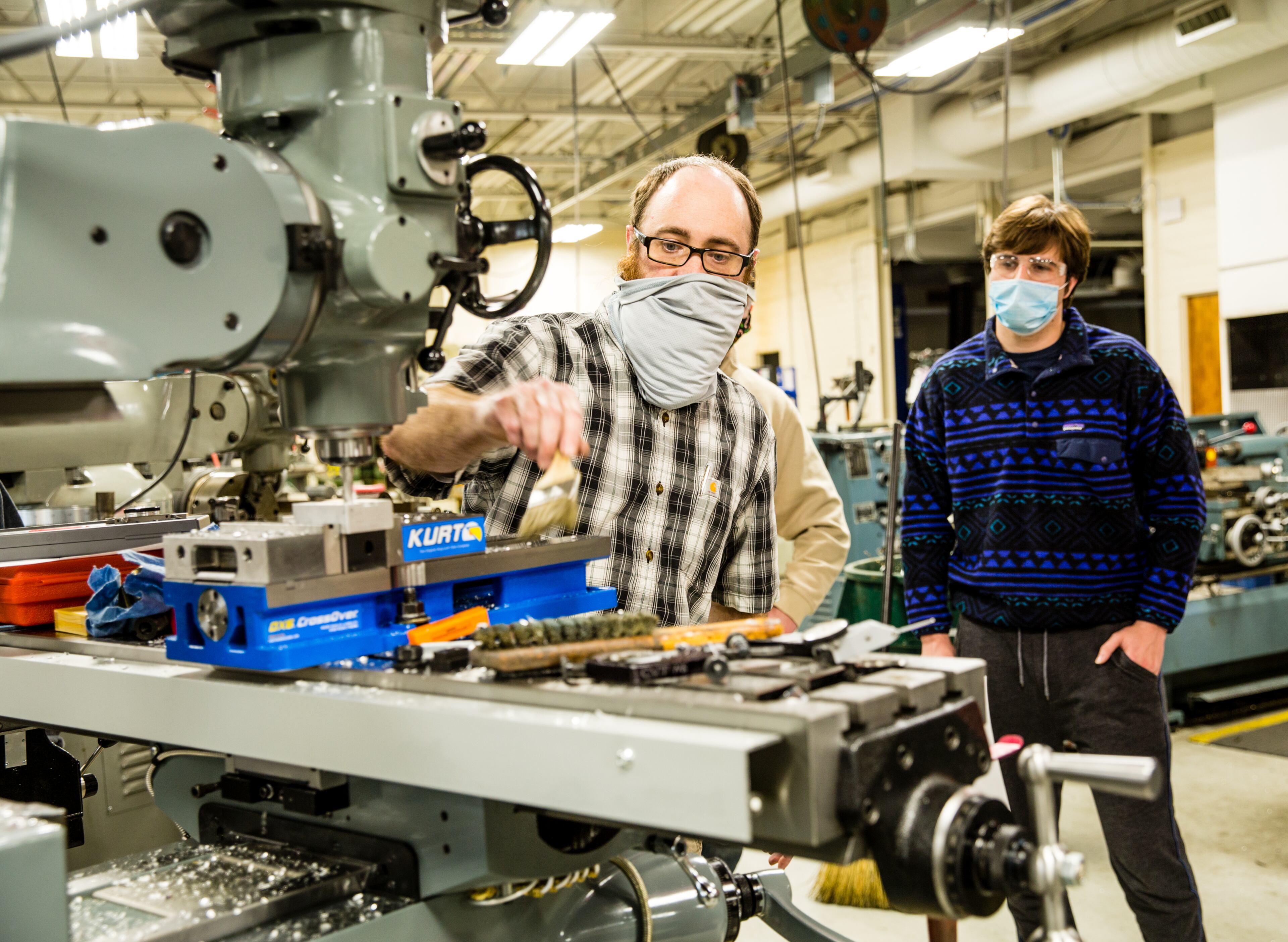Georgia Northwestern Technical College in Rome, GA continues conducting classes, including precision machining and manufacturing labs, with smaller groups to allow for COVID-19 social distancing and with remote learning when possible Tuesday, Jan 26, 2021. Instructor Bart Jenkins demonstrates a few basics for a class of new students including Trey Prater, right. (Jenni Girtman for The Atlanta Journal-Constitution)
