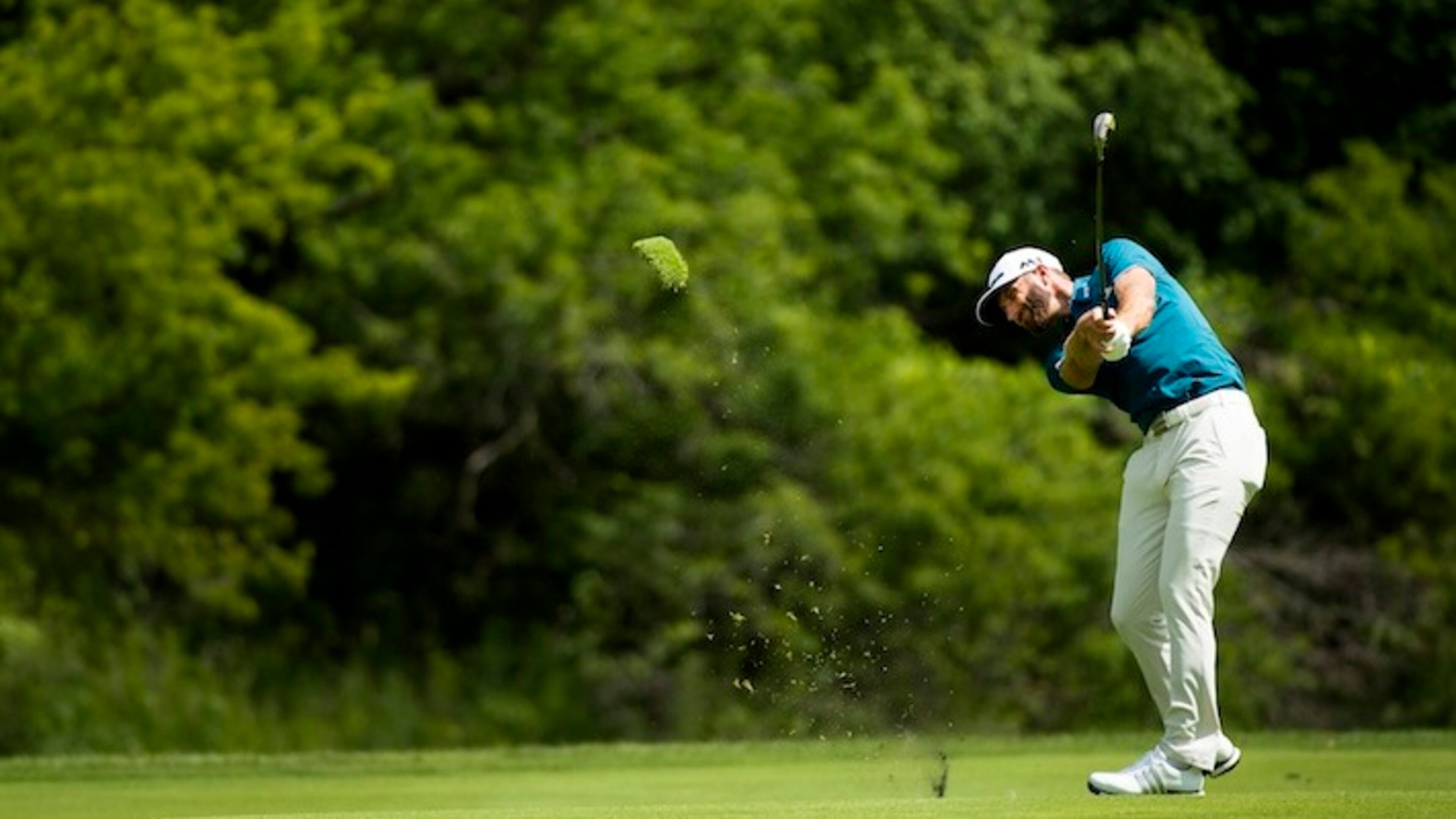 Dustin Johnson, of the United States, hits his approach shot on the 14th hole during the Canadian Open golf tournament at Glen Abbey golf club, in Oakville, Ontario, on Saturday, July 29, 2017. (Nathan Denette/The Canadian Press via AP)