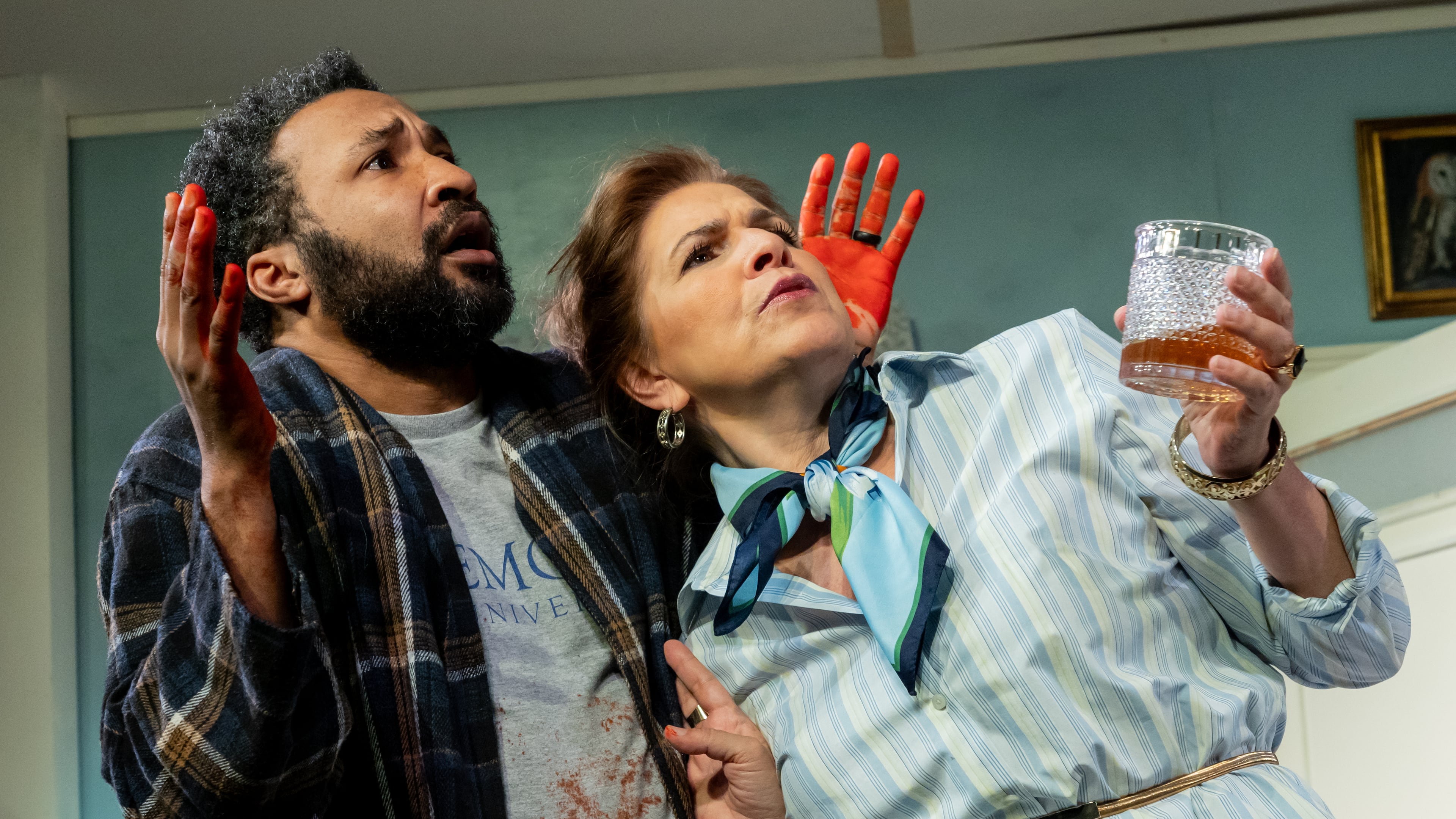 Timothy (Christopher Hampton, left) and his wife, Sloane, decide to share their home with a drifter in Steve Yockey's farce "Bleeding Hearts" at Theatrical Outfit. Further complicating matters is that every time neighbor Felicia (Tess Malis Kincaid, right) visits, more of the couple's possessions disappear. (Courtesy of Casey Gardner Ford)