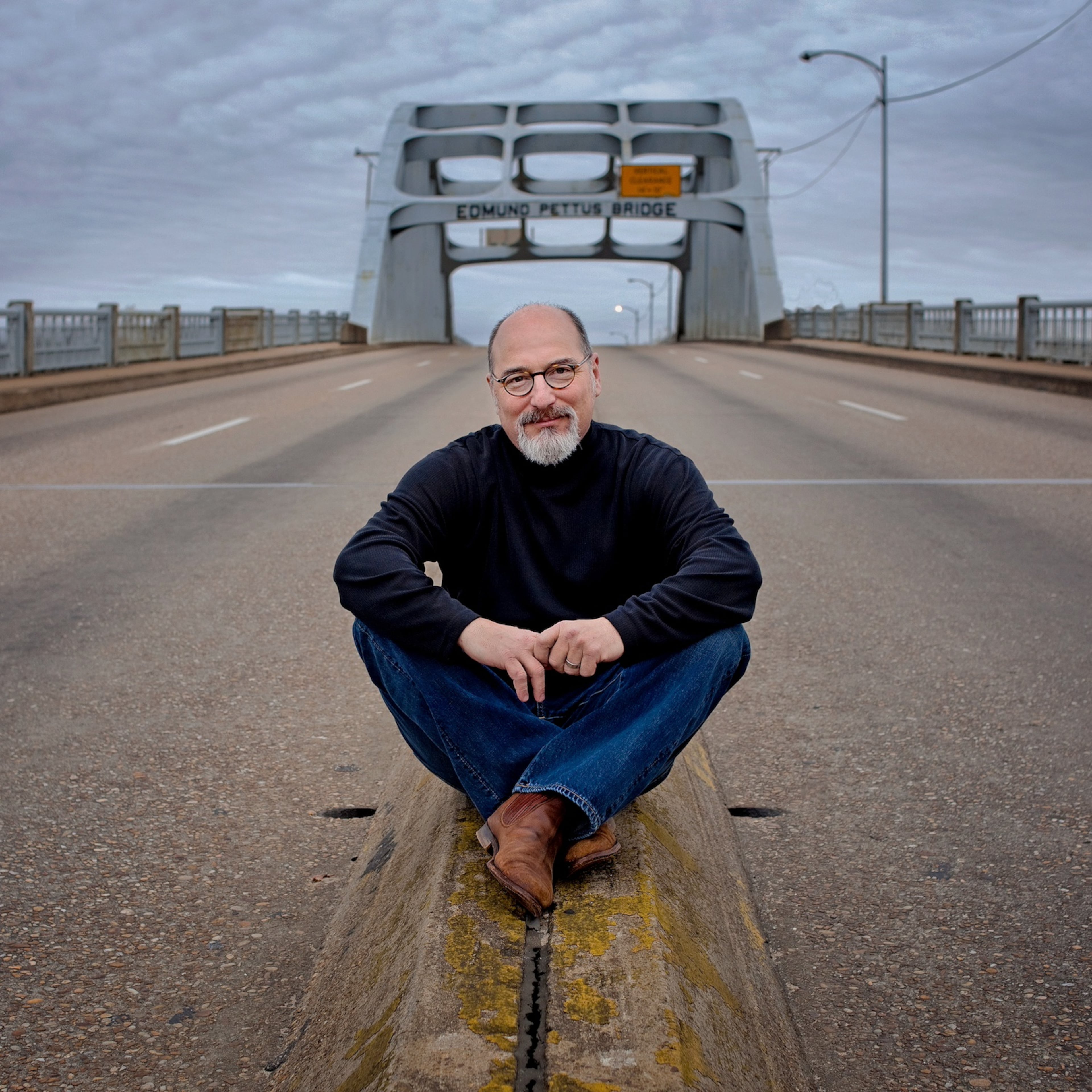 Photographer Jerry Siegel poses on the iconic Edmund Pettus Bridge in his hometown of Selma, Alabama. A National Portrait Gallery curator says the museum seeks to "expand its representation of southern portrait subjects as well as southern photographers.” (Courtesy of Jerry Siegel)