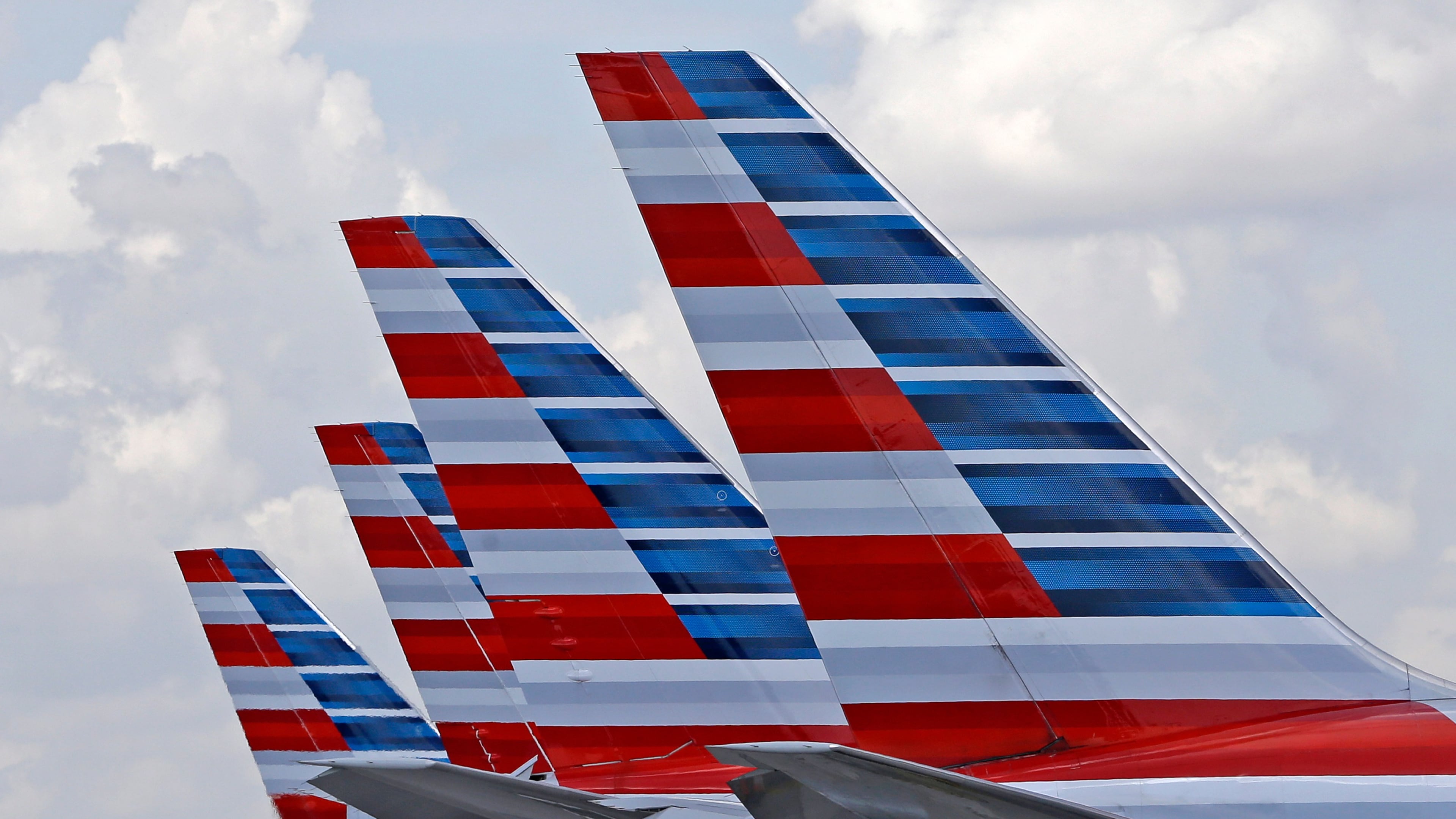 FILE - American Airlines passenger planes are parked at Miami International Airport, in Miami on July 17, 2015. (AP Photo/Alan Diaz, File)