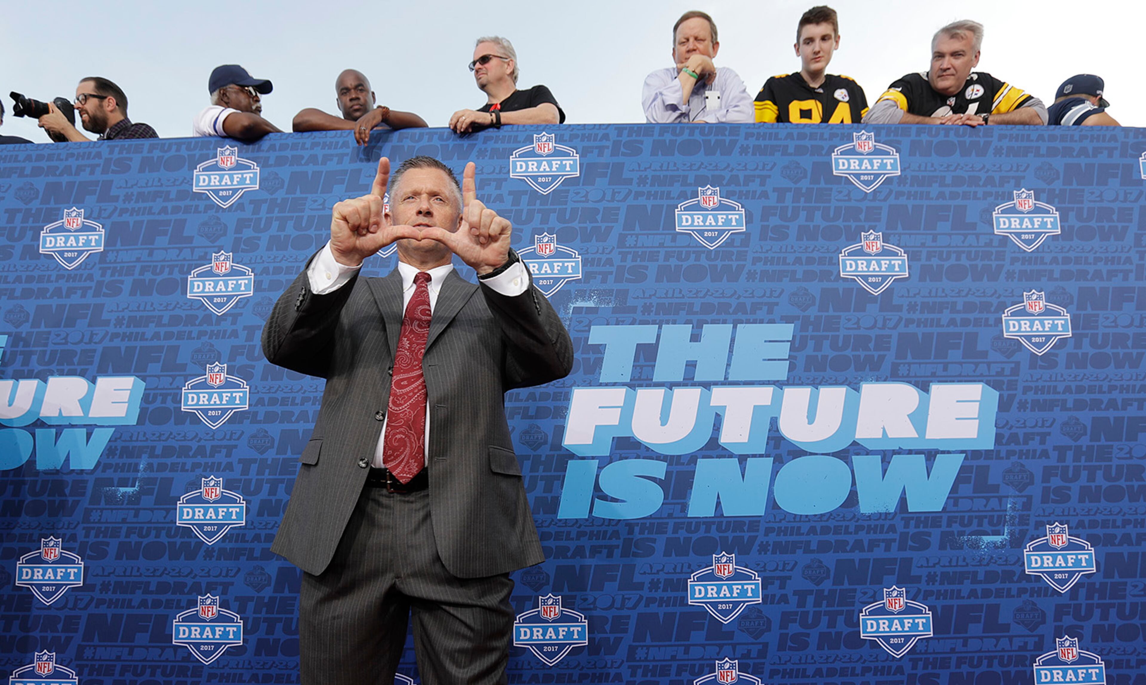 Utah coach Kyle Whittingham arrives for the first round of the 2017 NFL football draft, Thursday, April 27, 2017, in Philadelphia. (AP Photo/Julio Cortez)