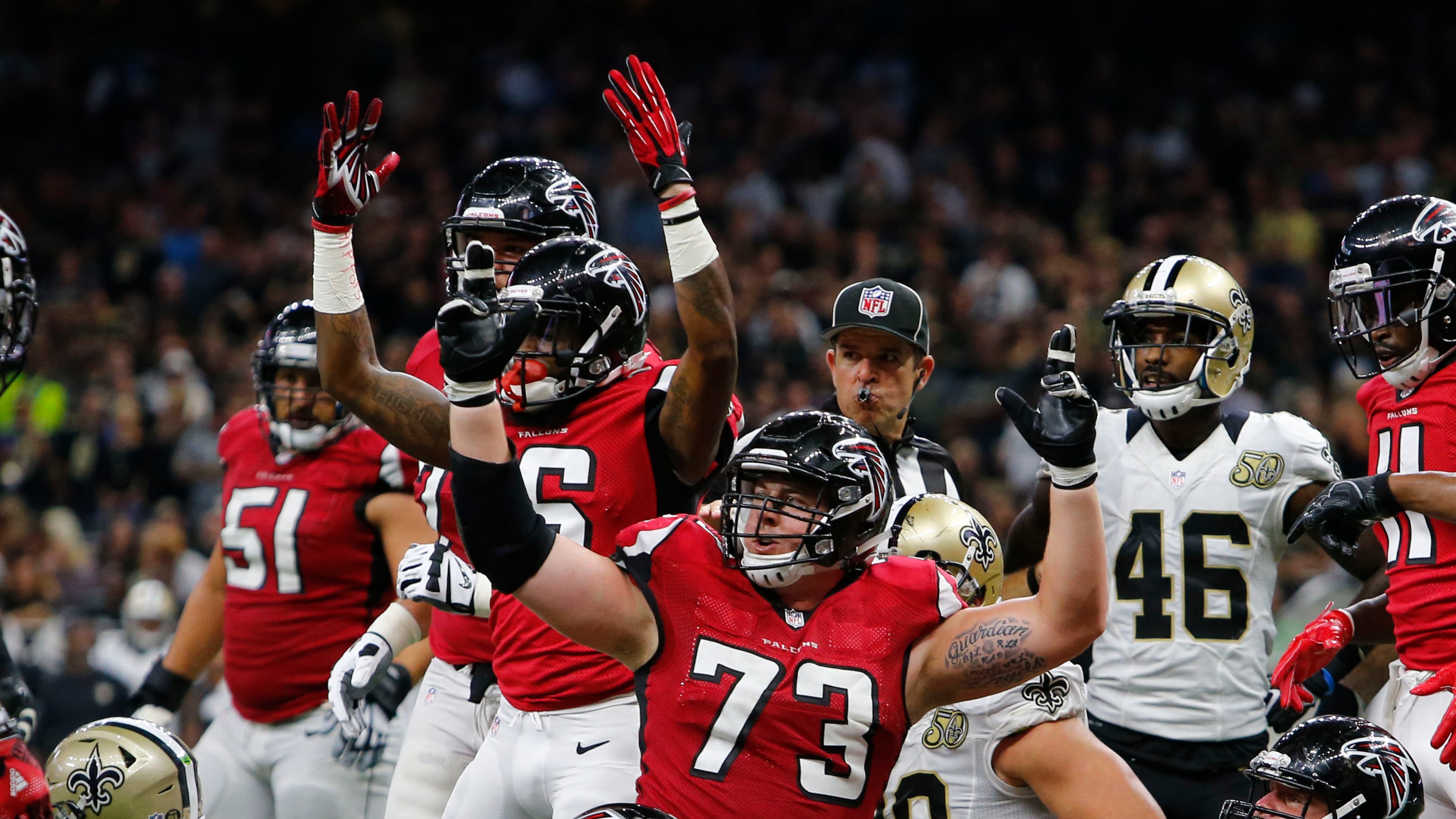 Atlanta Falcons tackle Ryan Schraeder (73) reacts to the official on a score by Tevin Coleman, behind Schraeder, in the first half of an NFL football game against the Atlanta Falcons in New Orleans, Monday, Sept. 26, 2016. (AP Photo/Butch Dill)
