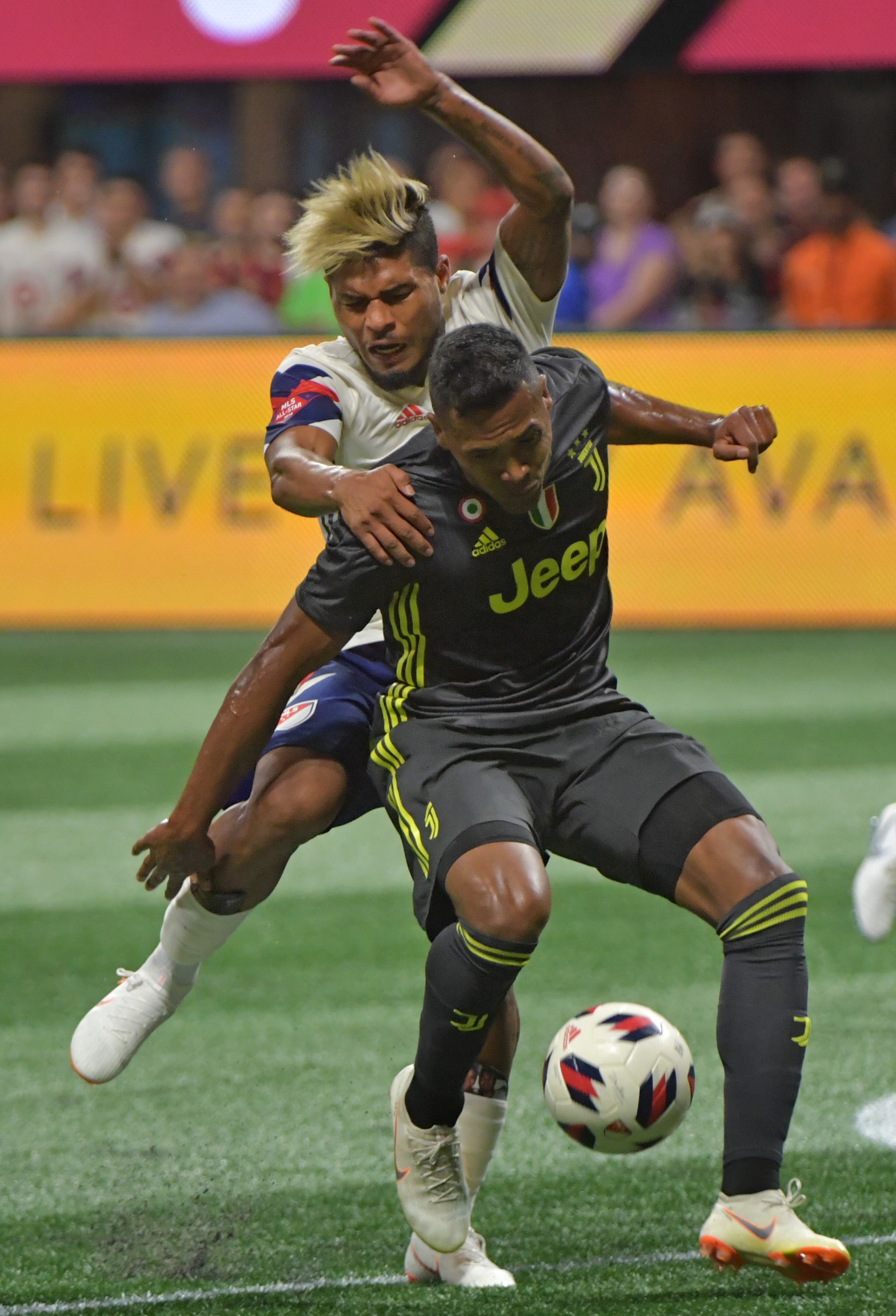 MLS ALL-STARS : Atlanta - MLS All-Stars forward Josef Martinez (17) battles Juventus defender Alex Sandro (12) for the ball in the first half of the Major League Soccer All-Star Game at the Mercedes-Benz Stadium on Wednesday, August 1, 2018. HYOSUB SHIN / HSHIN@AJC.COM