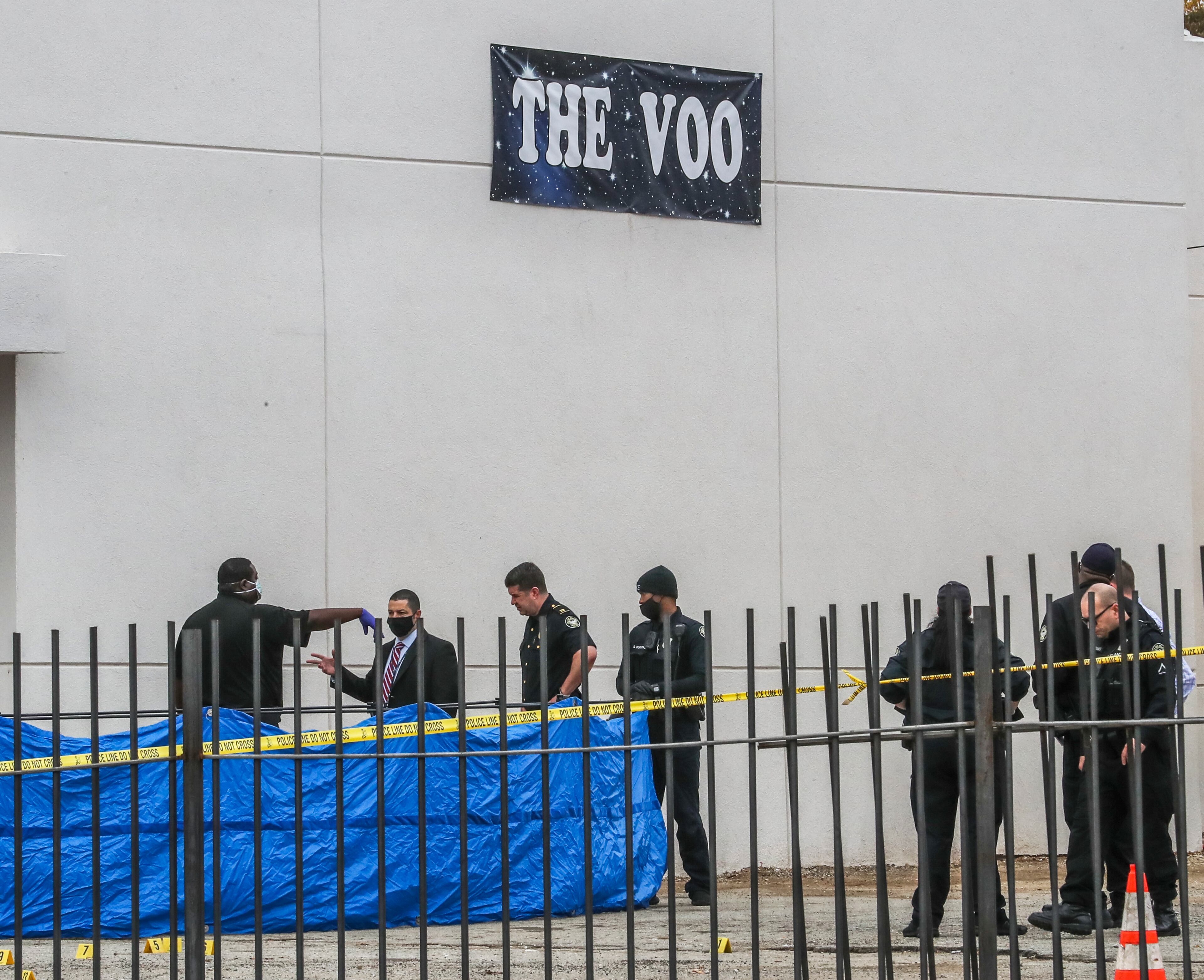 The shooting left one man dead and a bystander injured in the parking lot of The Voo lounge, police said.