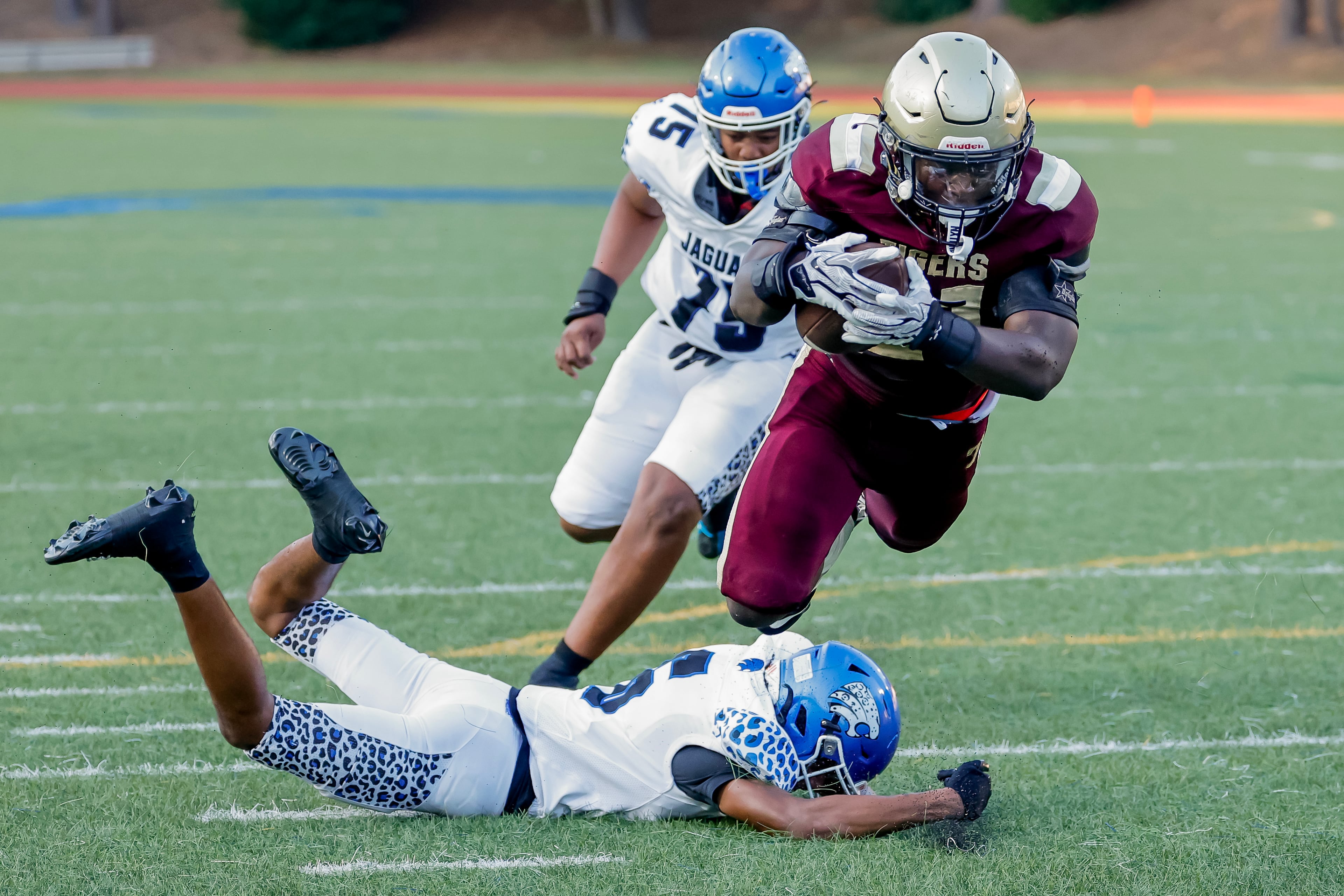 Tucker’s Thaddeous Tillman (right) scores a touchdown against Stephenson defender Josiah Ashmon during their game at Hallford Stadium on Friday, Sept. 4, 2026, in Clarkston. (Erik S. Lesser for the AJC)