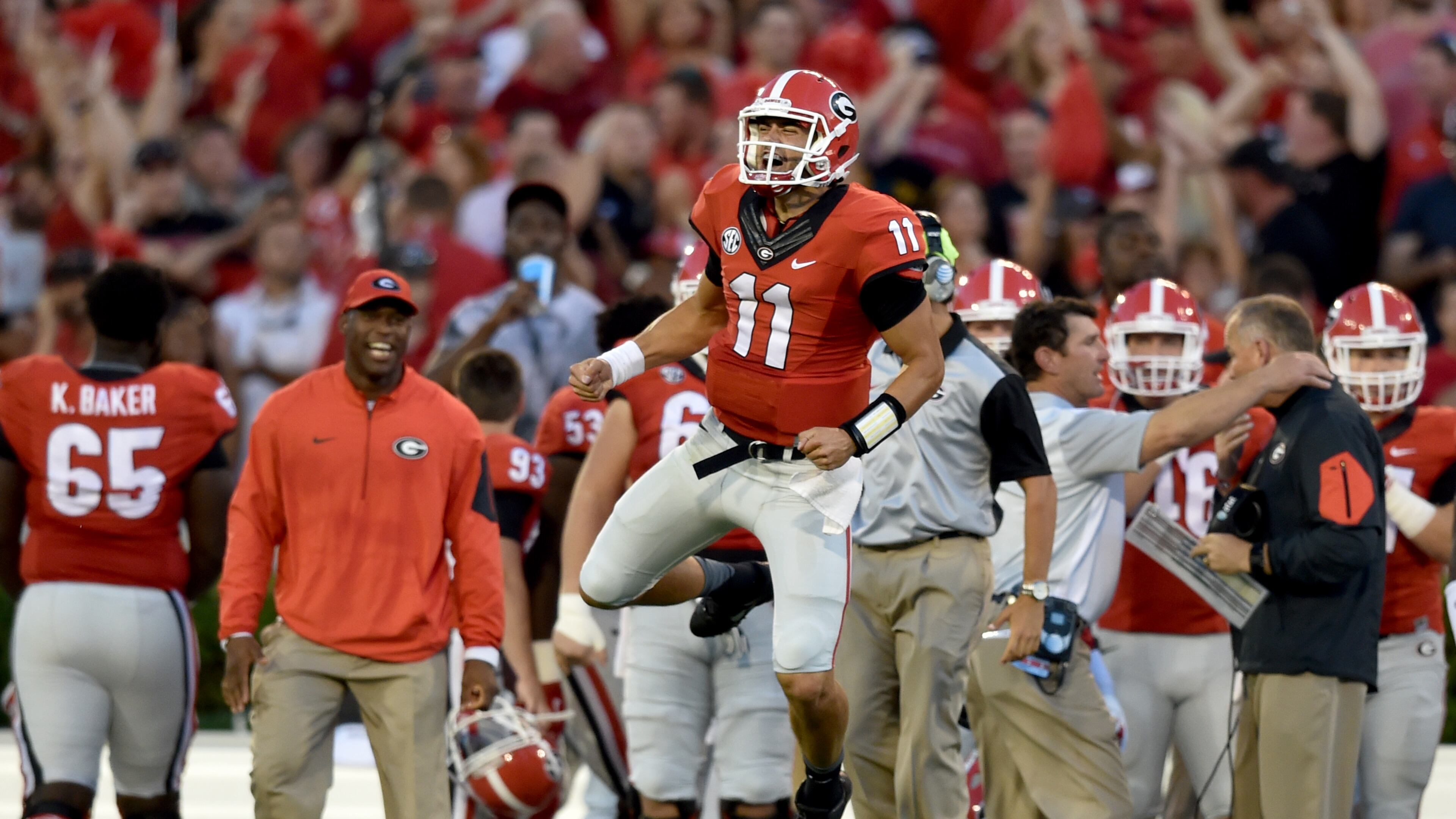 Georgia quarterback Greyson Lambert celebrates after connecting with wide receiver Malcolm Mitchell for a touchdown against South Carolina. (Brant Sanderlin, bsanderlin@ajc.com)