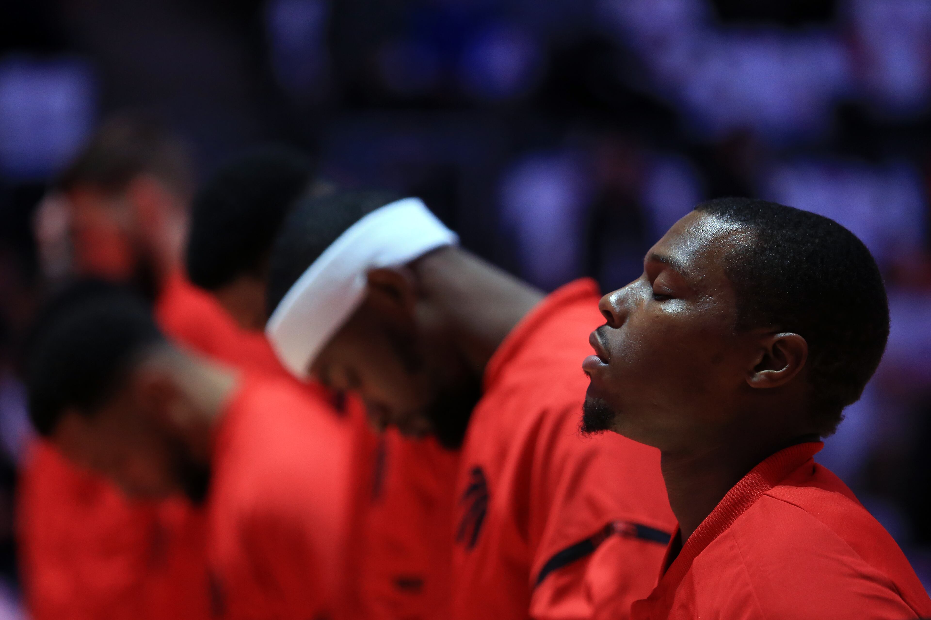 Kyle Lowry #7 of the Toronto Raptors and teammates line up for the anthems prior to an NBA game against the Detroit Pistons at Air Canada Centre on October 26, 2016 in Toronto, Canada. (Photo by Vaughn Ridley/Getty Images)