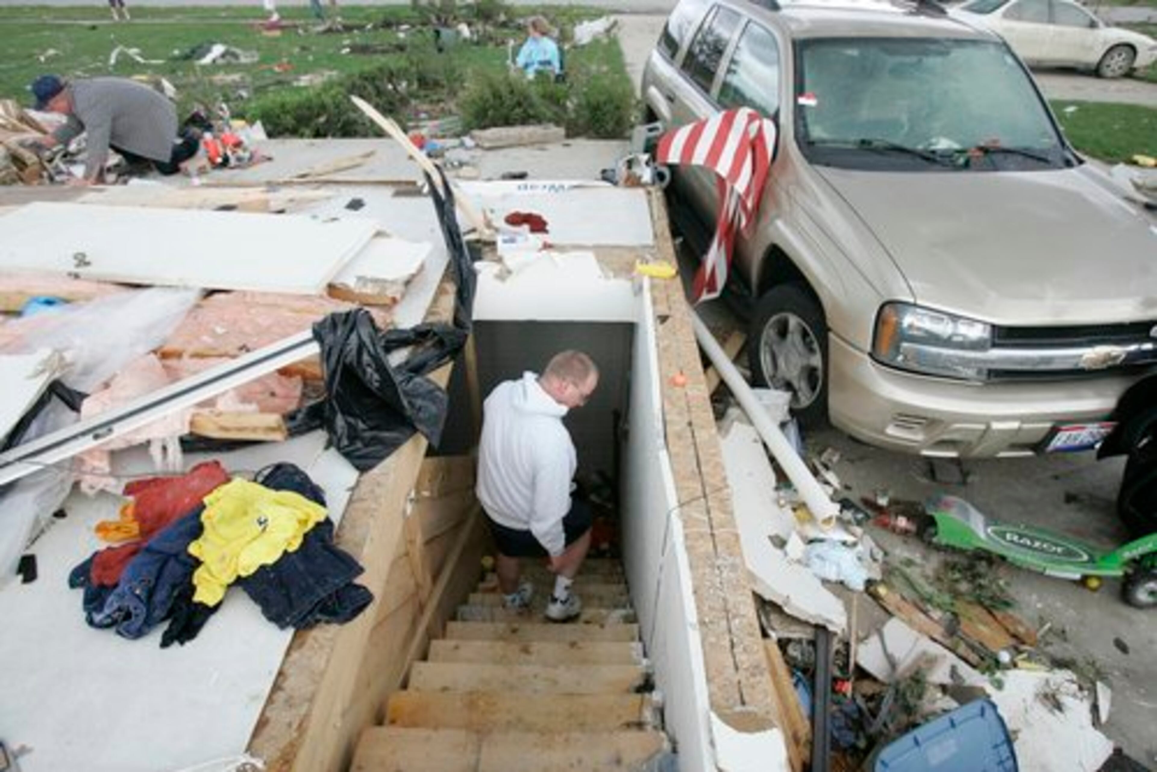 Scott Swartz walks down his basement stairs in Millbury, Ohio, Sunday, June 6, 2010. He, his wife and twelve-year-old son took shelter there before the tornado destroyed their home.