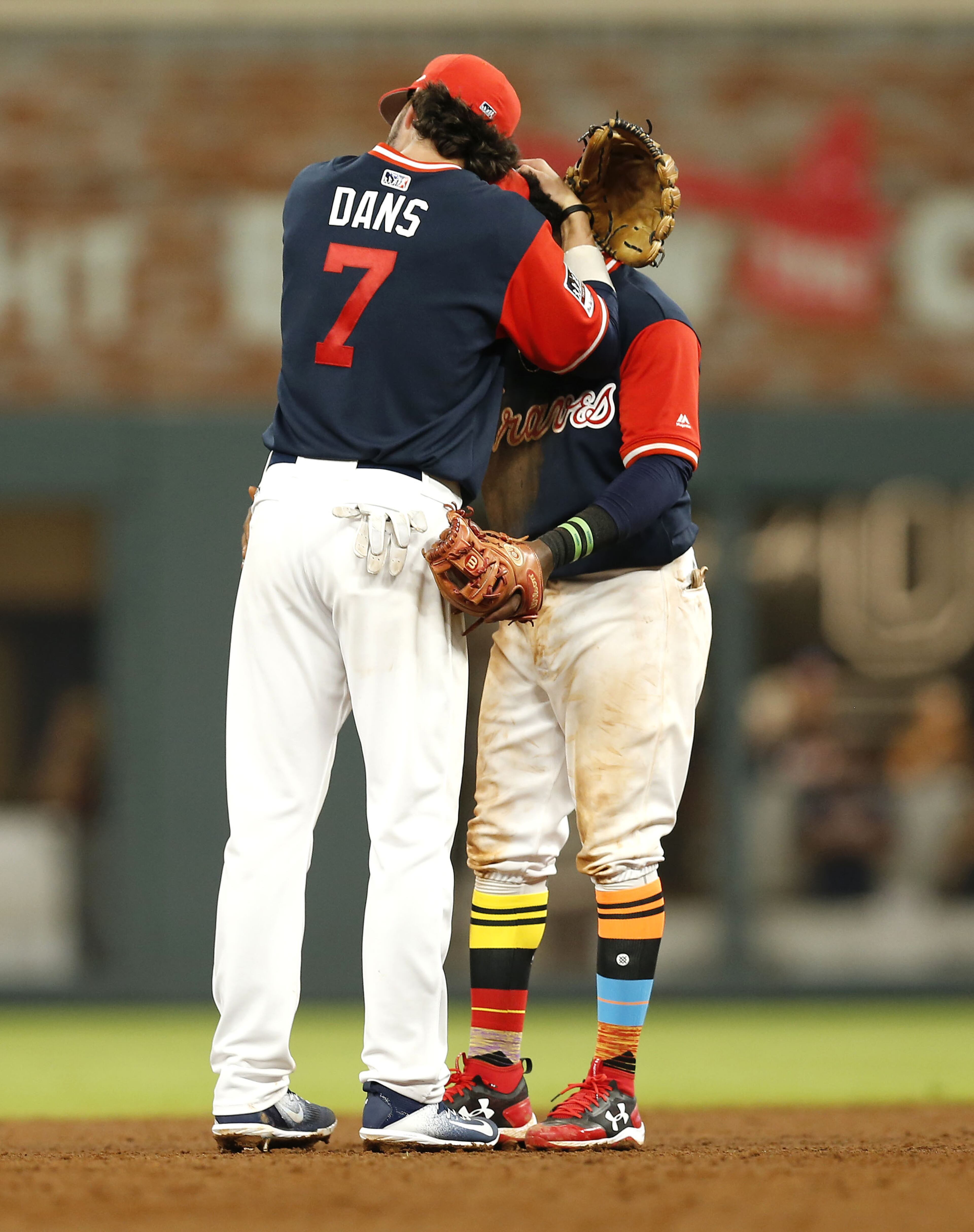 ATLANTA, GA - AUGUST 25: Shortstop Dansby Swanson #7 of the Atlanta Braves celebrates with second baseman Ozzie Albies #1 after the game against the Colorado Rockies at SunTrust Park on August 25, 2017 in Atlanta, Georgia. (Photo by Mike Zarrilli/Getty Images)