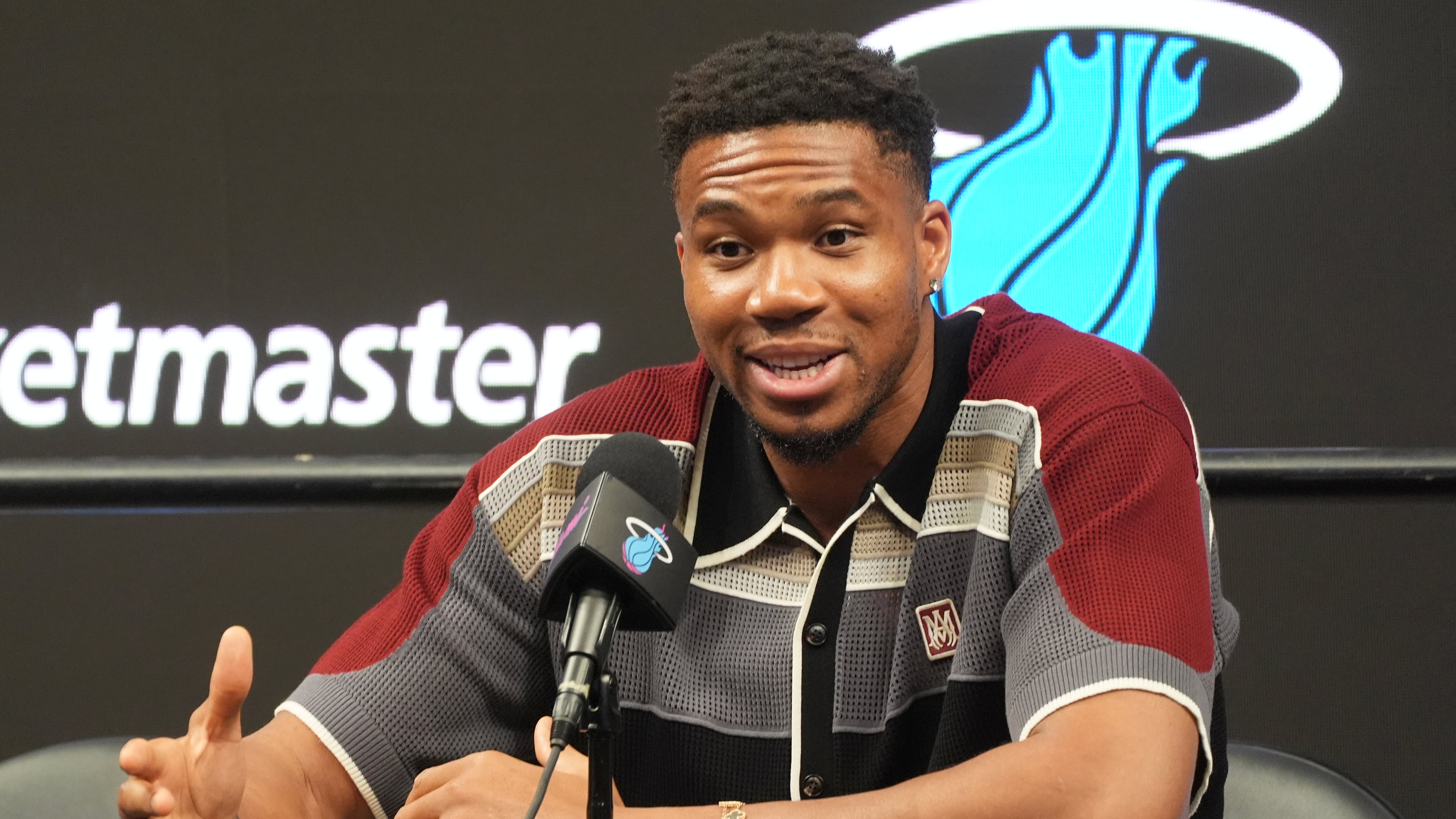 Giannis Antetokounmpo speaks during a news conference where he was introduced as a new member of the Miami Heat team Thursday, July 16, 2026, in Miami. (AP Photo/Marta Lavandier)