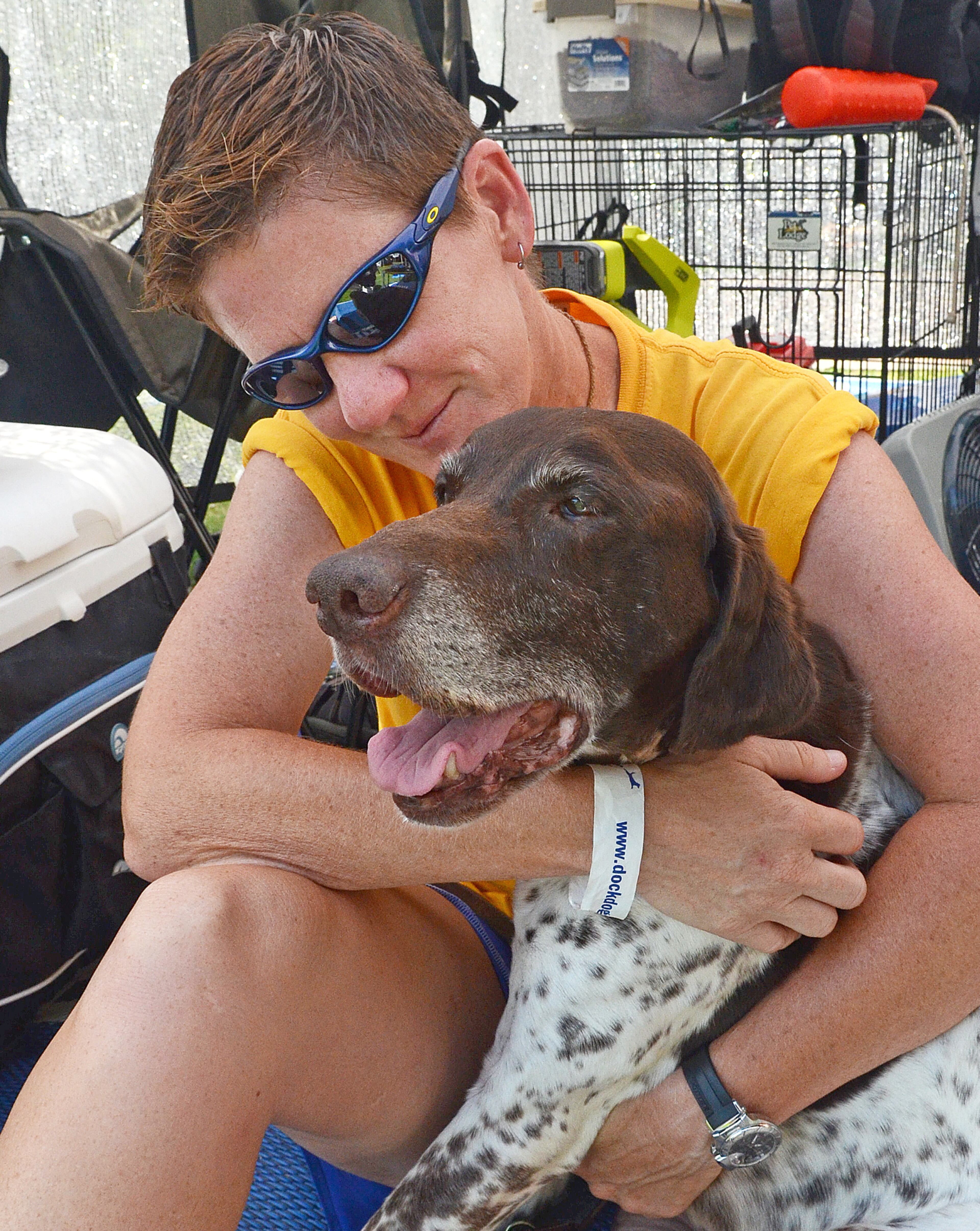 Sue Barns of Iowa hugs 15-year-old, a Hall of Famer and a National Champion, who is still competing. Barns likes to say, "Every dog has its story." (CHRIS HUNT/SPECIAL)