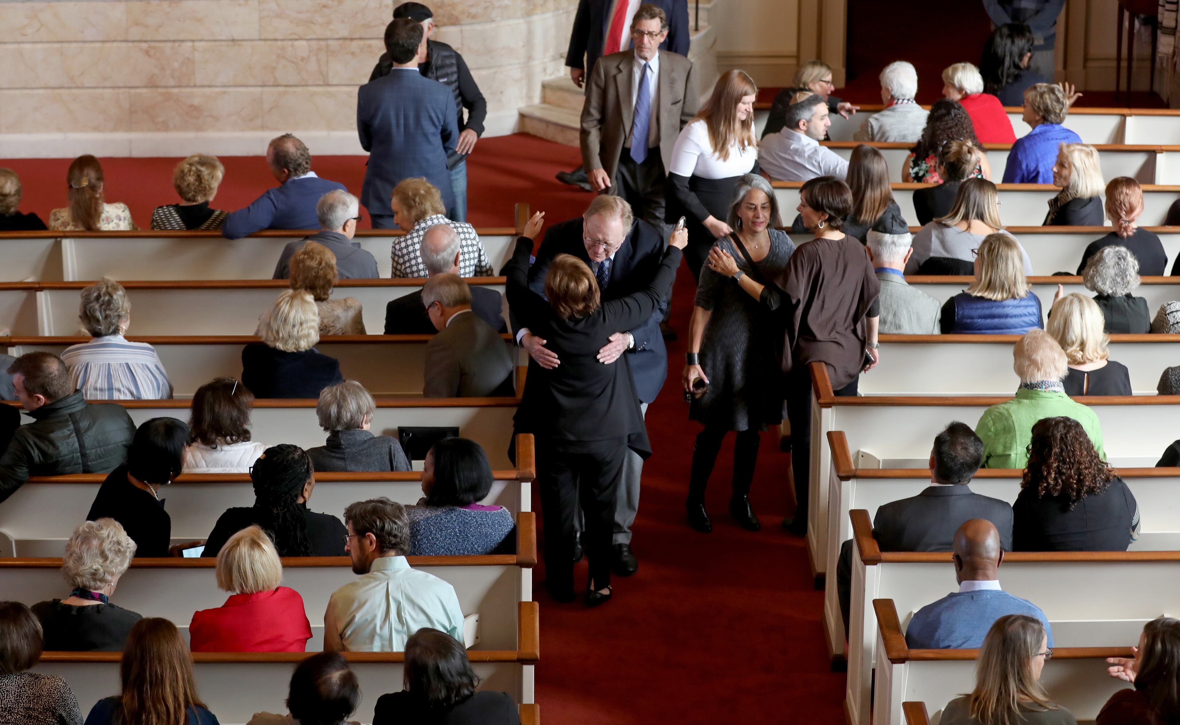 October 30, 2018 - Atlanta, Ga: People greet each other before the start of a prayer vigil for the Pittsburgh synagogue shooting at The Temple Tuesday, October 30, 2018, in Atlanta. The Temple hosted an interfaith prayer vigil in conjunction with Outcry. The event was in honor of the eleven people killed at a Pittsburgh synagogue Saturday Oct. 27th. (JASON GETZ/SPECIAL TO THE AJC)