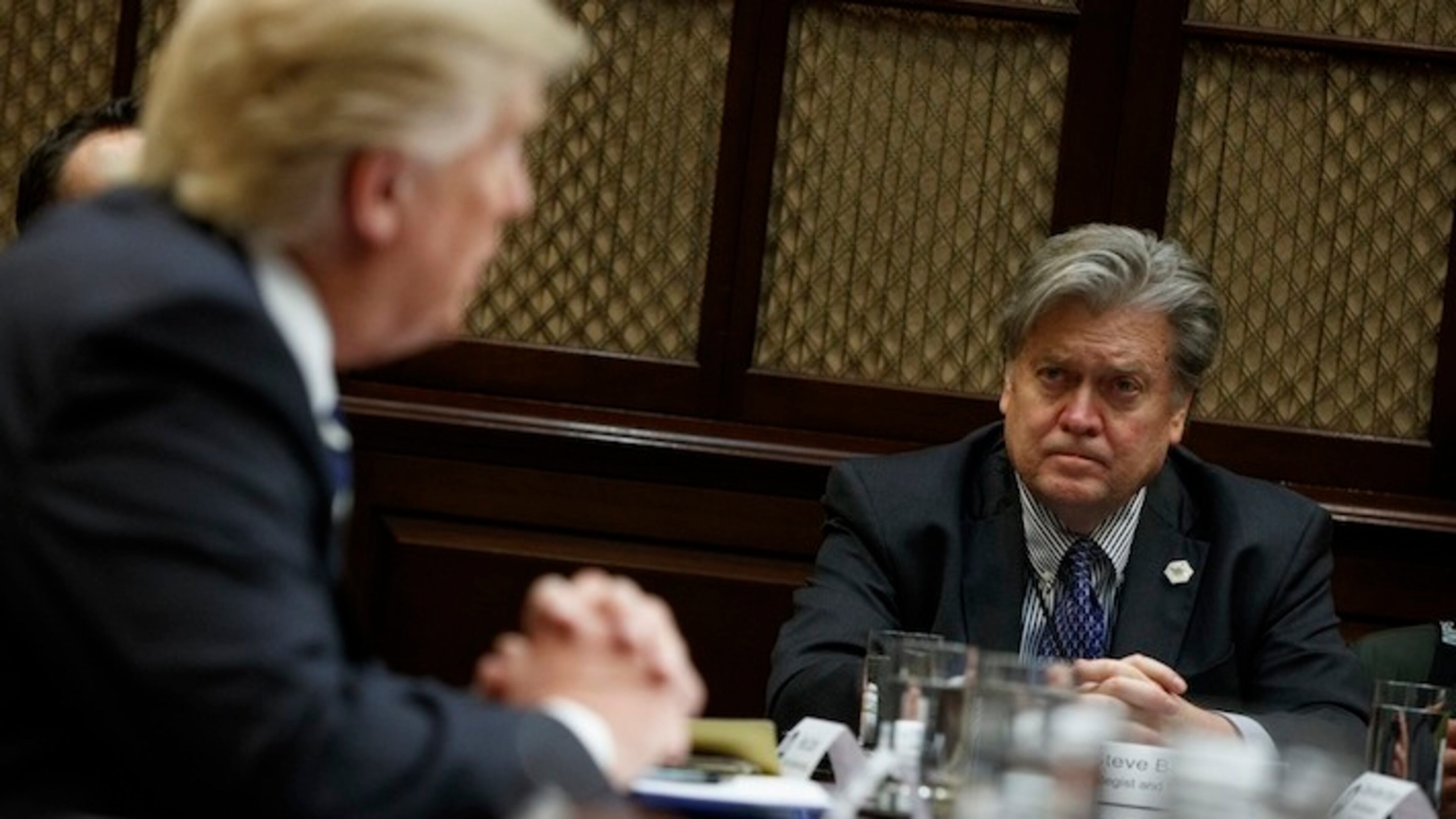 White House Chief Strategist Steve Bannon listens at right as President Donald Trump speaks during a meeting on cyber security in the Roosevelt Room of the White House in Washington, Tuesday, Jan. 31, 2017. (AP Photo/Evan Vucci)