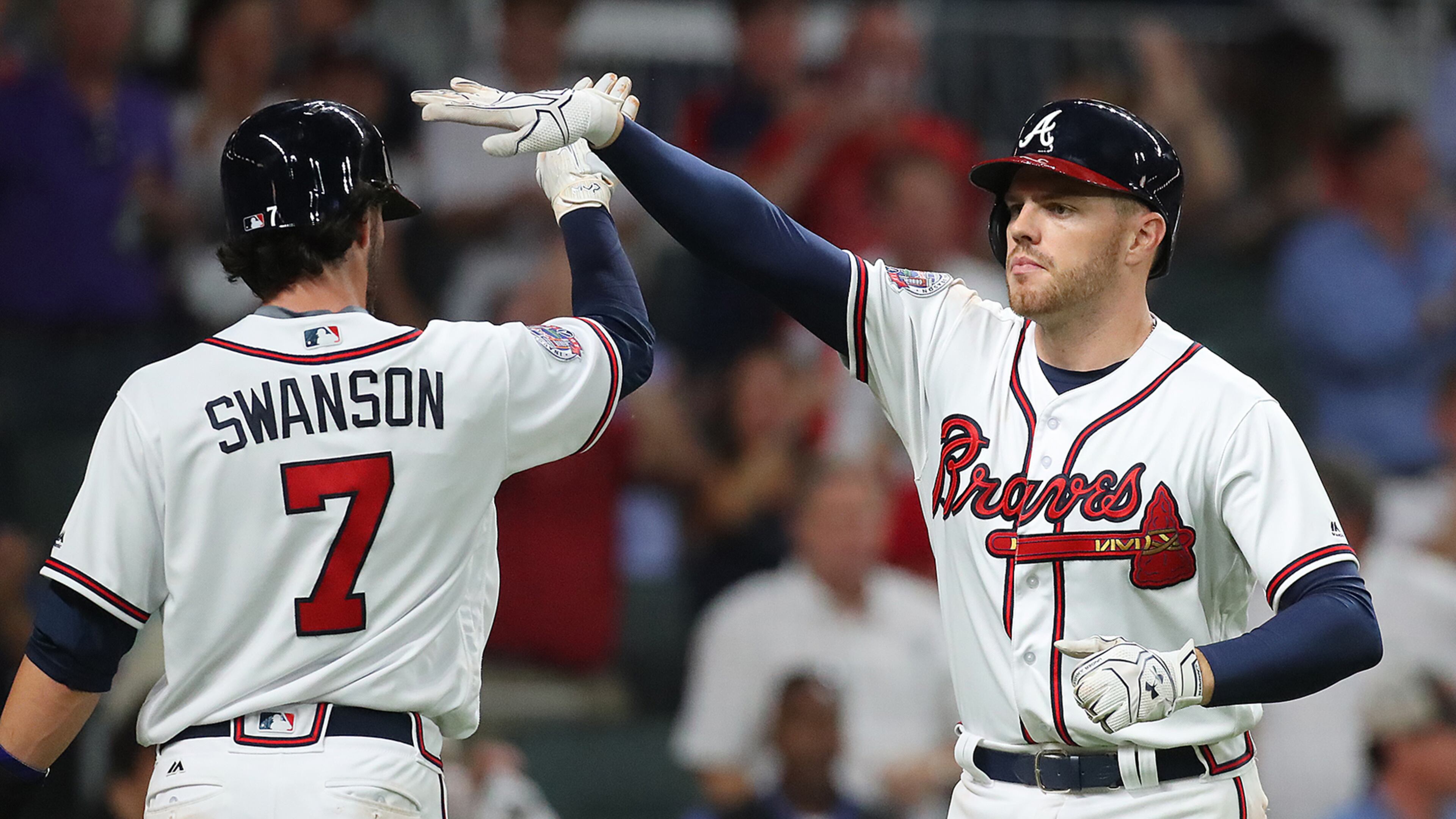 Freddie Freeman is greeted following what is sure to be among the first of many home runs he hits at the Braves new home park. (Curtis Compton/ccompton@ajc.com)