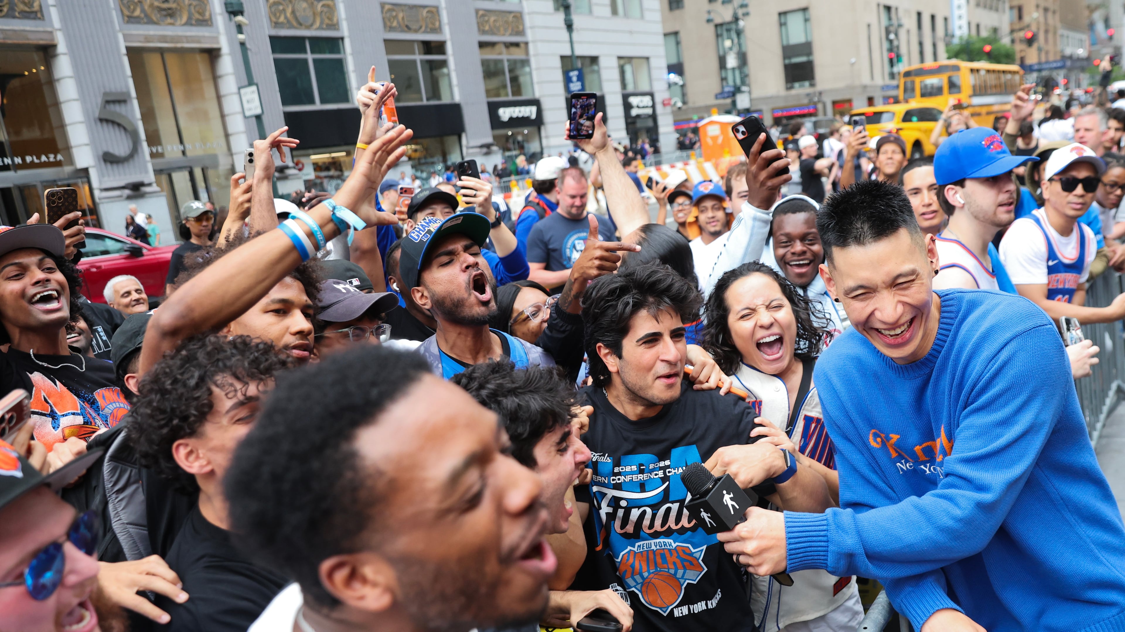 Former New York Knicks player Jeremy Lin, right, interviews Knicks fans outside of Madison Square Garden ahead of Game 4 of the NBA Finals between the Knicks and San Antonio Spurs, Wednesday, June 10, 2026, in New York. (AP Photo/Heather Khalifa)