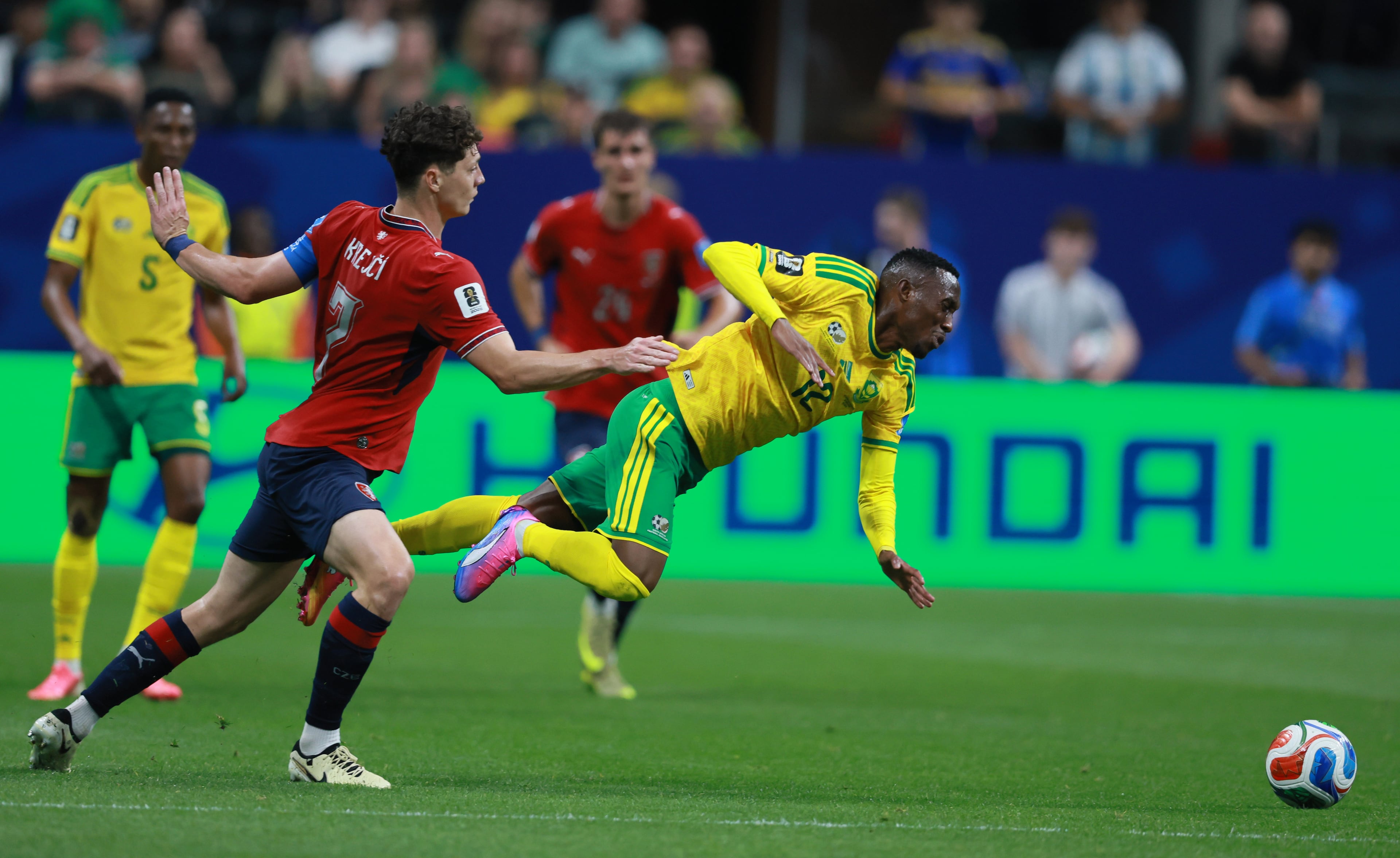 South Africa's Thapelo Maseko (center) gets tripped up by Czechia's Ladislav Krejčí during the first half of the Czechia vs. South Africa game at the FIFA World Cup at Atlanta Stadium on Thursday, June 18, 2026. (Jason Getz/AJC)