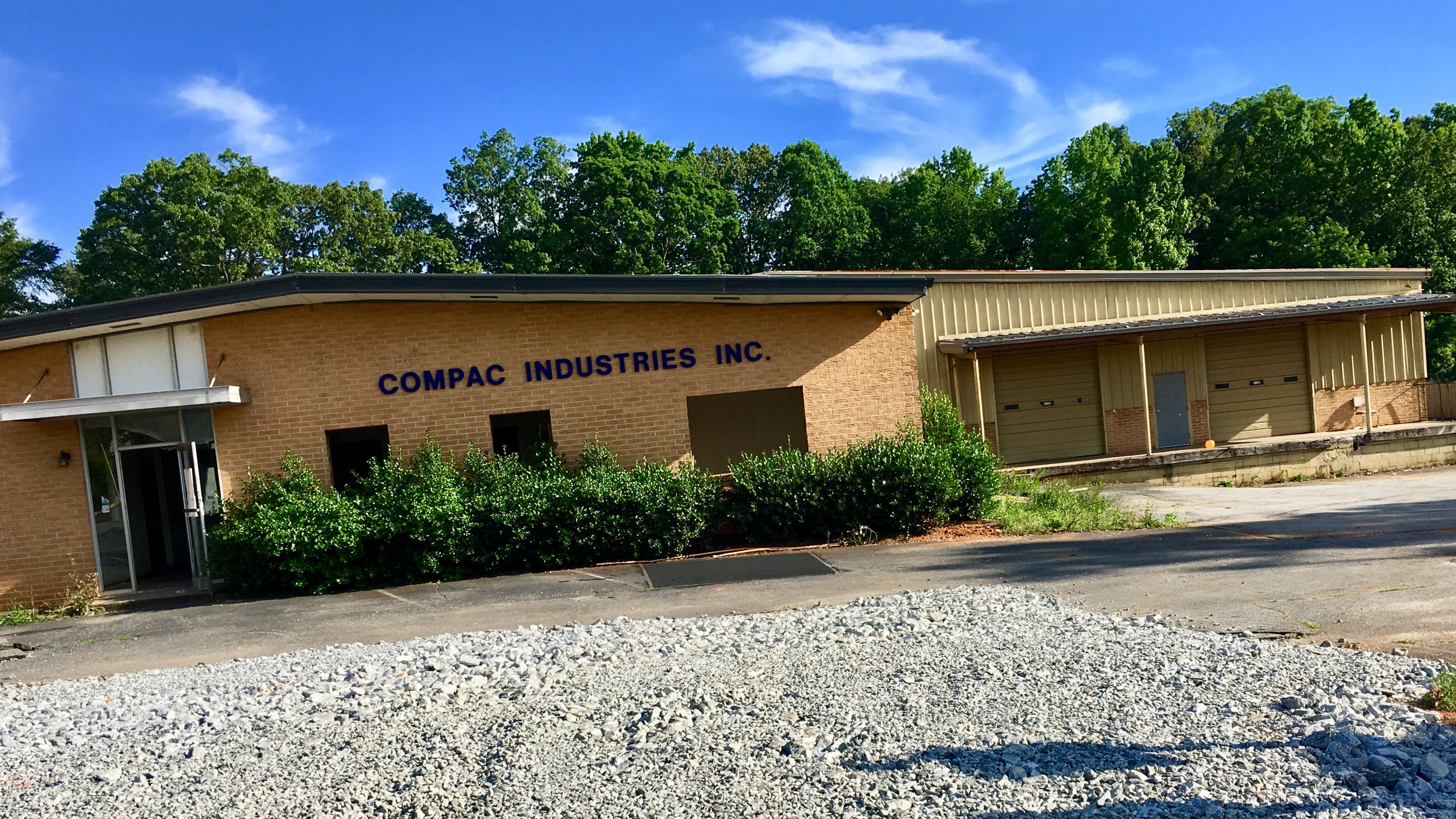 A portion of the six-acre site on Talley Street where the new Decatur school will get built. Most of the summer will be spent demoslishing several old commercial buildings and houses on the site, including this office building and warehouse. The school’s scheduled to open in August, 2019. Bill Banks for the AJC