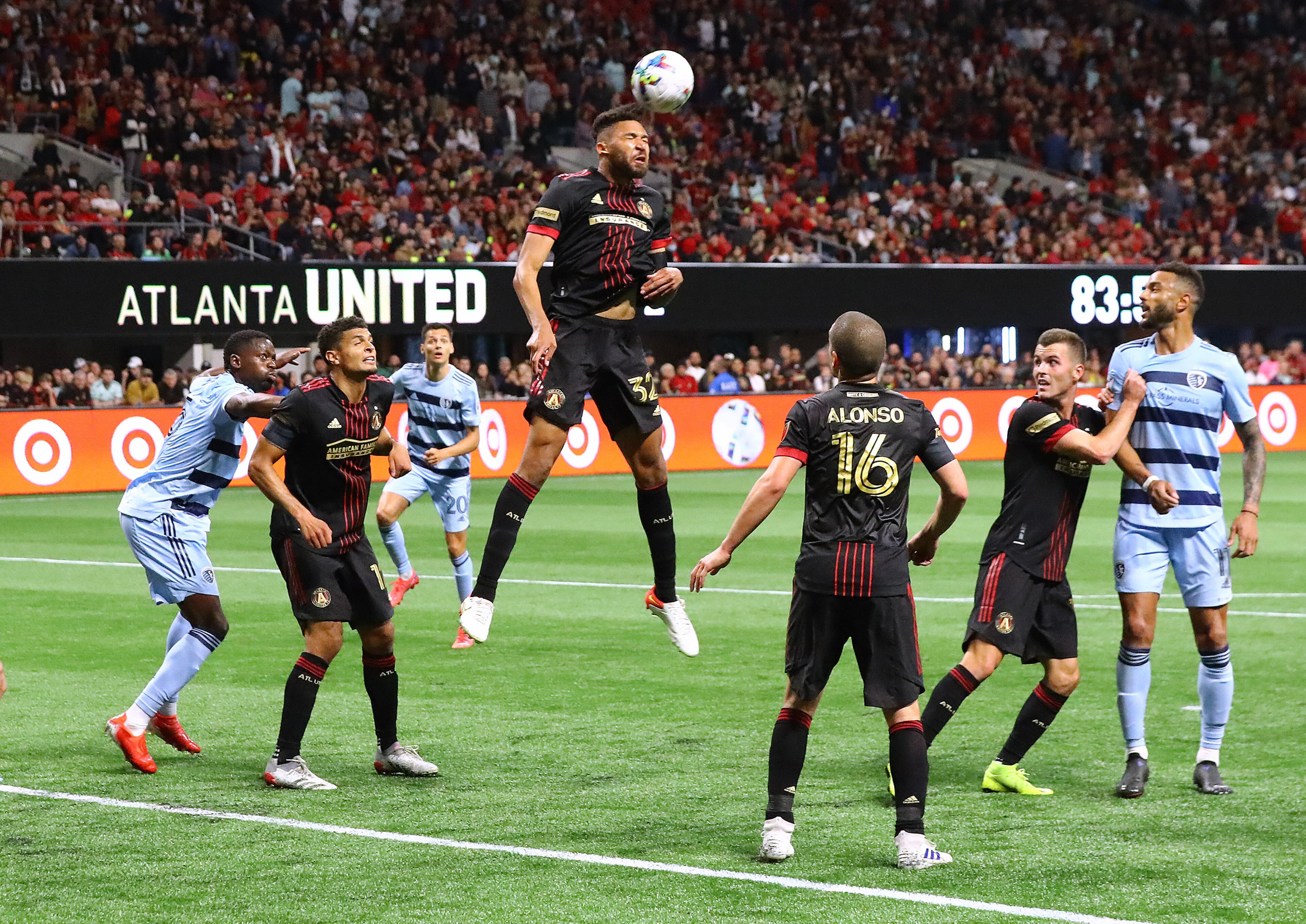 022722 : Atlanta United defender George Campbell clears a kick on goal away from the front of the net to hold onto a 3-1 victory over Sporting KC in an MLS soccer match on Sunday, Feb. 27, 2022, in Atlanta. “Curtis Compton / Curtis.Compton@ajc.com”`