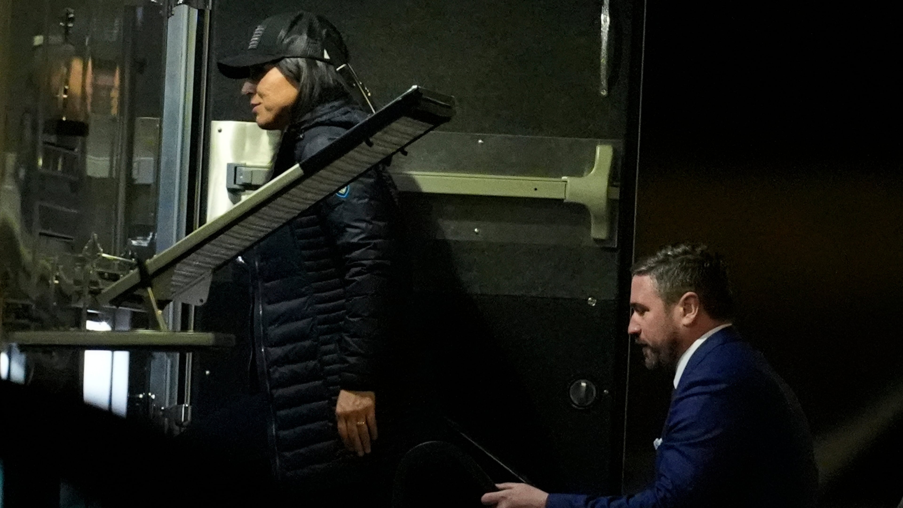 Director of National Intelligence Tulsi Gabbard, left, and FBI Deputy Director Andrew Bailey, enter a command vehicle as the FBI takes Fulton County 2020 Election ballots, Wednesday, Jan. 28, 2026, in Union City, Ga., near Atlanta. (AP Photo/Mike Stewart)