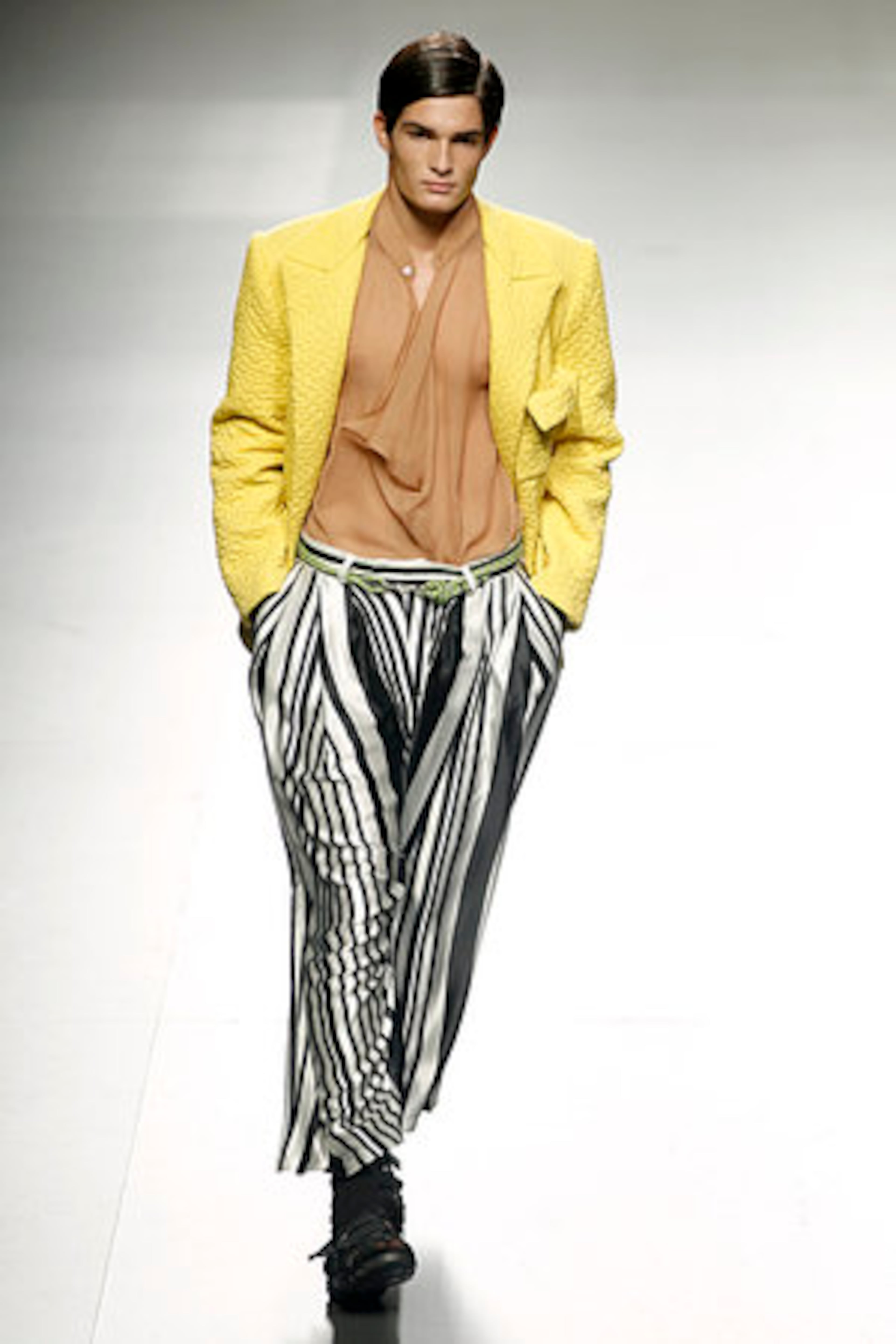 A model shows his stripes an Spring/Summer design by Alberto Puras during the Ego for young designers at the Pasarela Cibeles fashion show, in Madrid, Tuesday, Sept. 20, 2011.