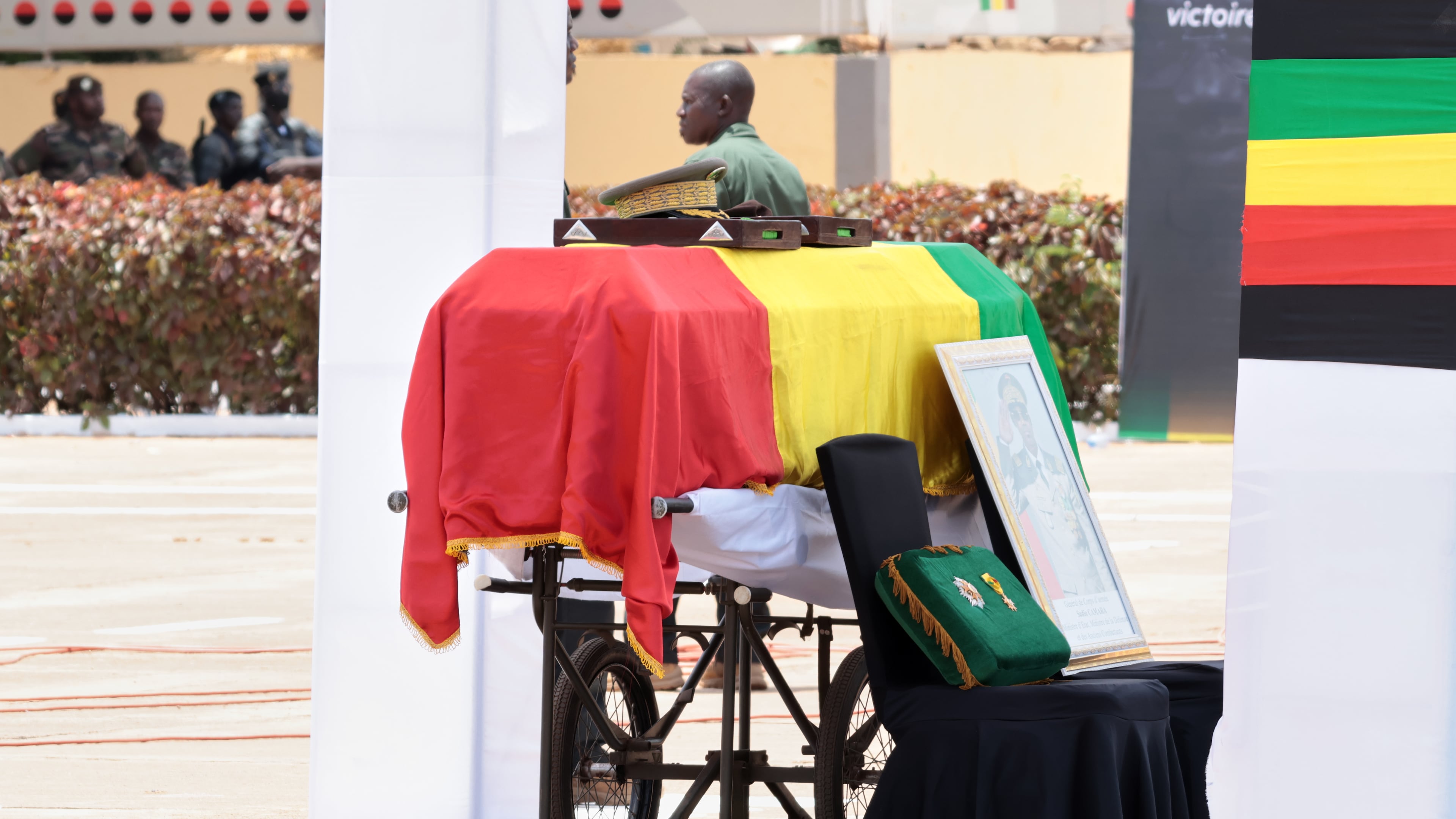 The flag draped casket that contains the remains of Mali's former defense minister Sadio Camara during a funeral ceremony at the Military Engineering Parade Ground in Bamako, Mali, Thursday, April 30, 2026. (AP Photo/Boubacary Bocoum)