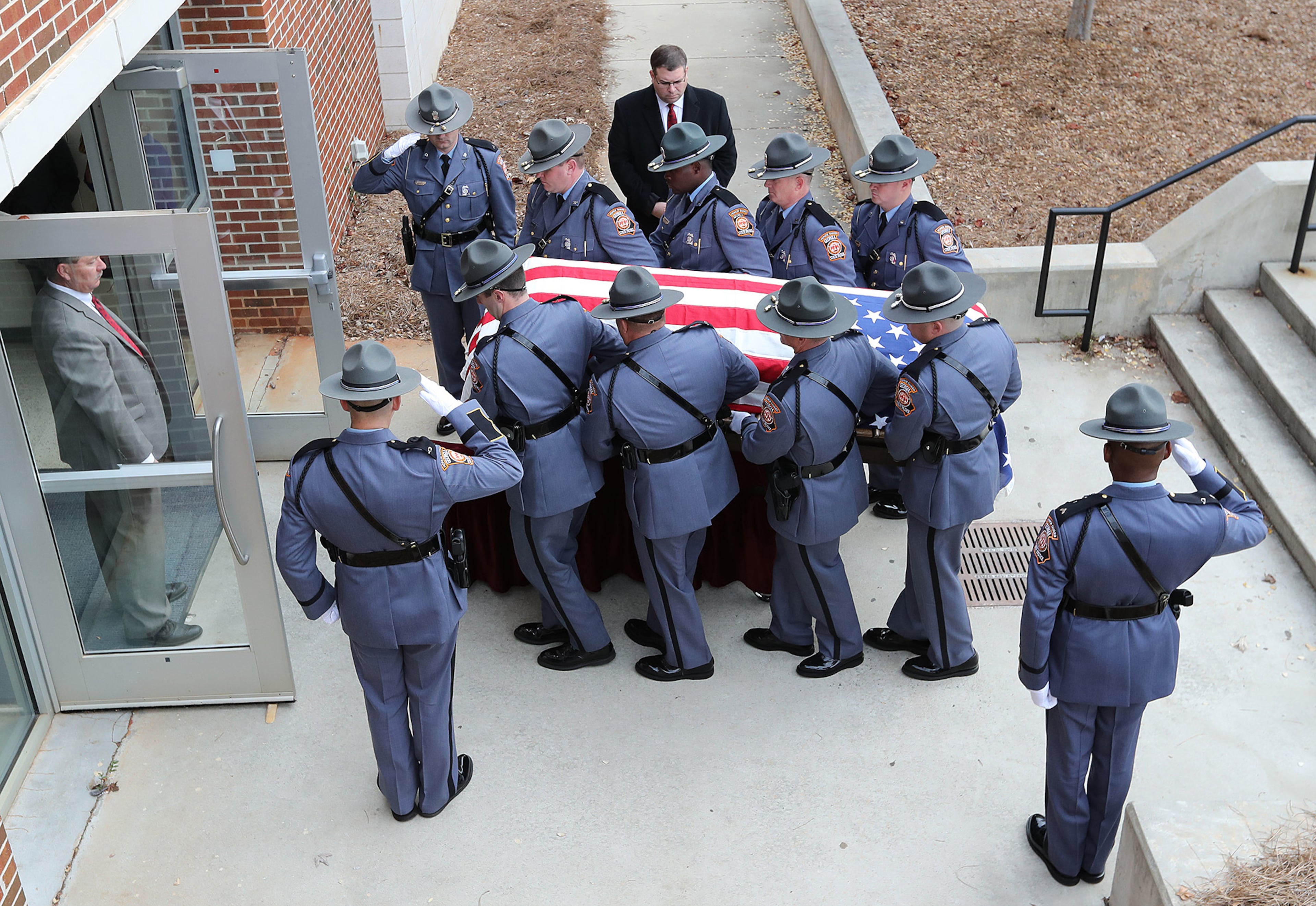 December 11, 2016, AMERICAS: Americus police officer Nicholas Ryan Smarr arrives by honor guard to his funeral service at the Georgia Southwestern State University Storm Dome on Sunday, Dec. 11, 2016, in Americas. Officer Smarr and Georgia Southwestern State University campus police officer Jody Smith were killed responding to a domestic dispute. Curtis Compton/ccompton@ajc.com