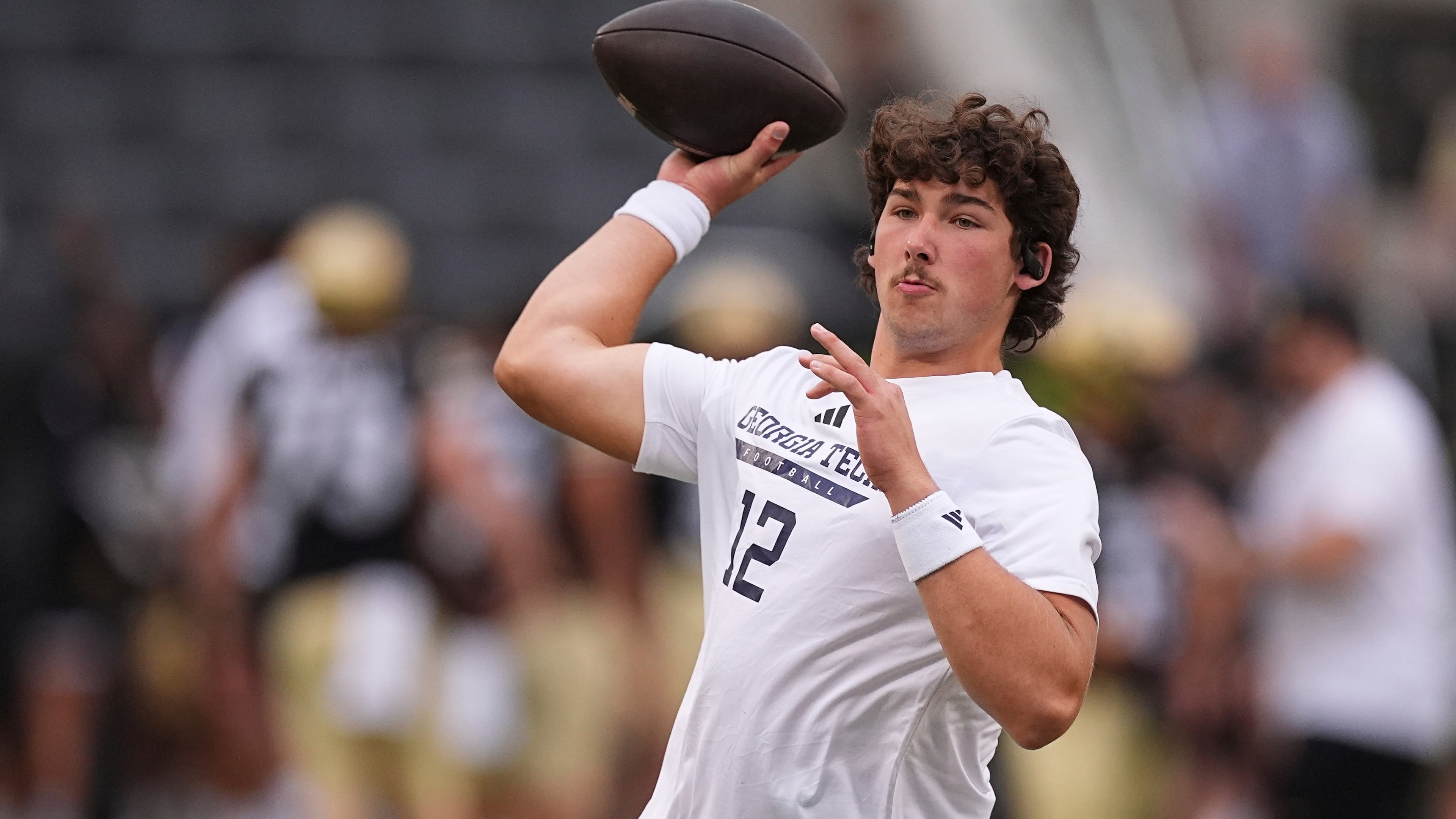 FILE - Georgia Tech quarterback Aaron Philo warms up before an NCAA college football game against Colorado, Friday, Aug. 29, 2025, in Boulder, Colo. (AP Photo/David Zalubowski, File)