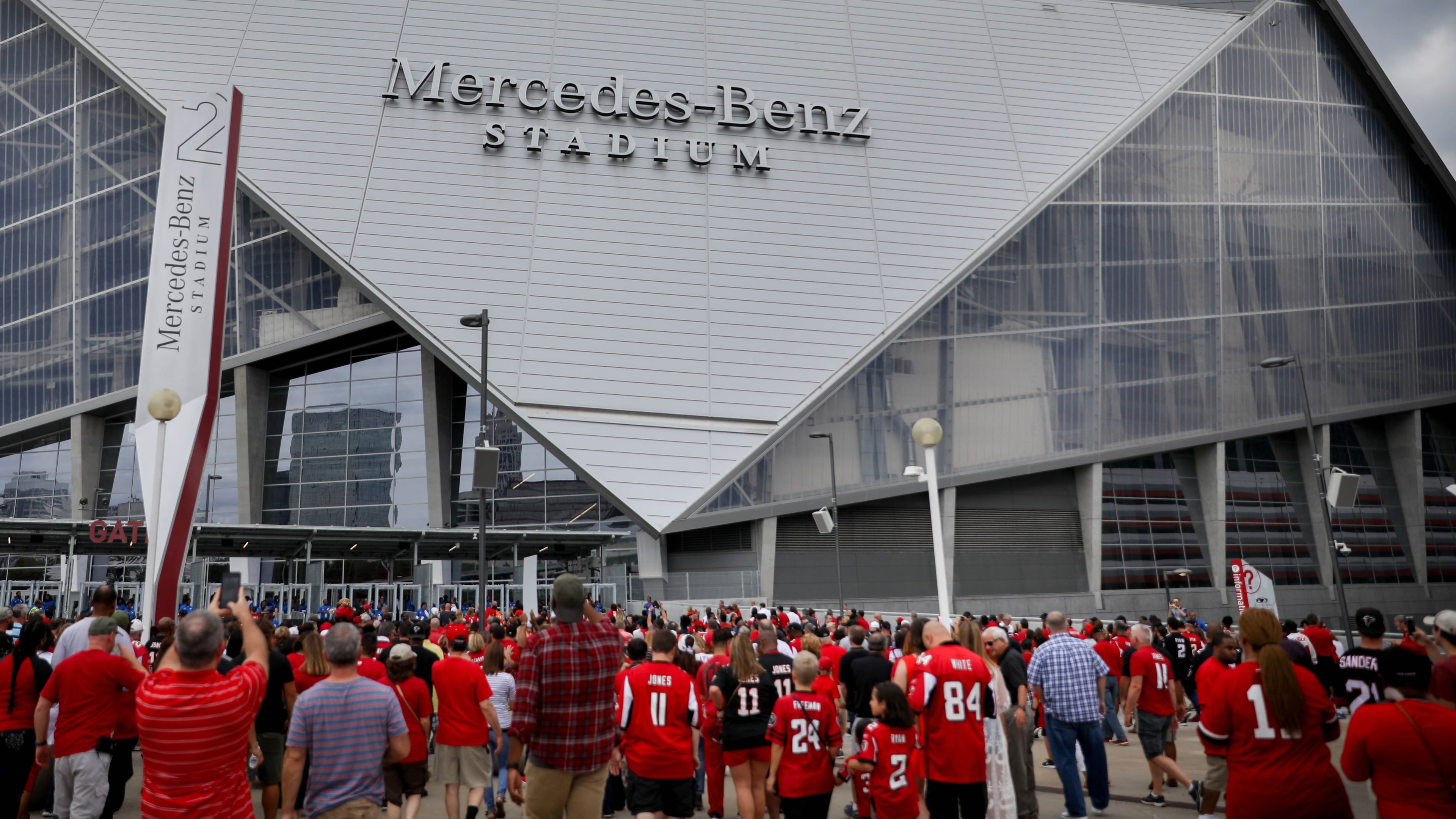 Fans enter the Mercedes-Benz Stadium, the new home of the Atlanta Falcons, before a pre-season game against the Arizona Cardinals, Saturday, Aug. 26, 2017, in Atlanta. BRANDEN CAMP/SPECIAL