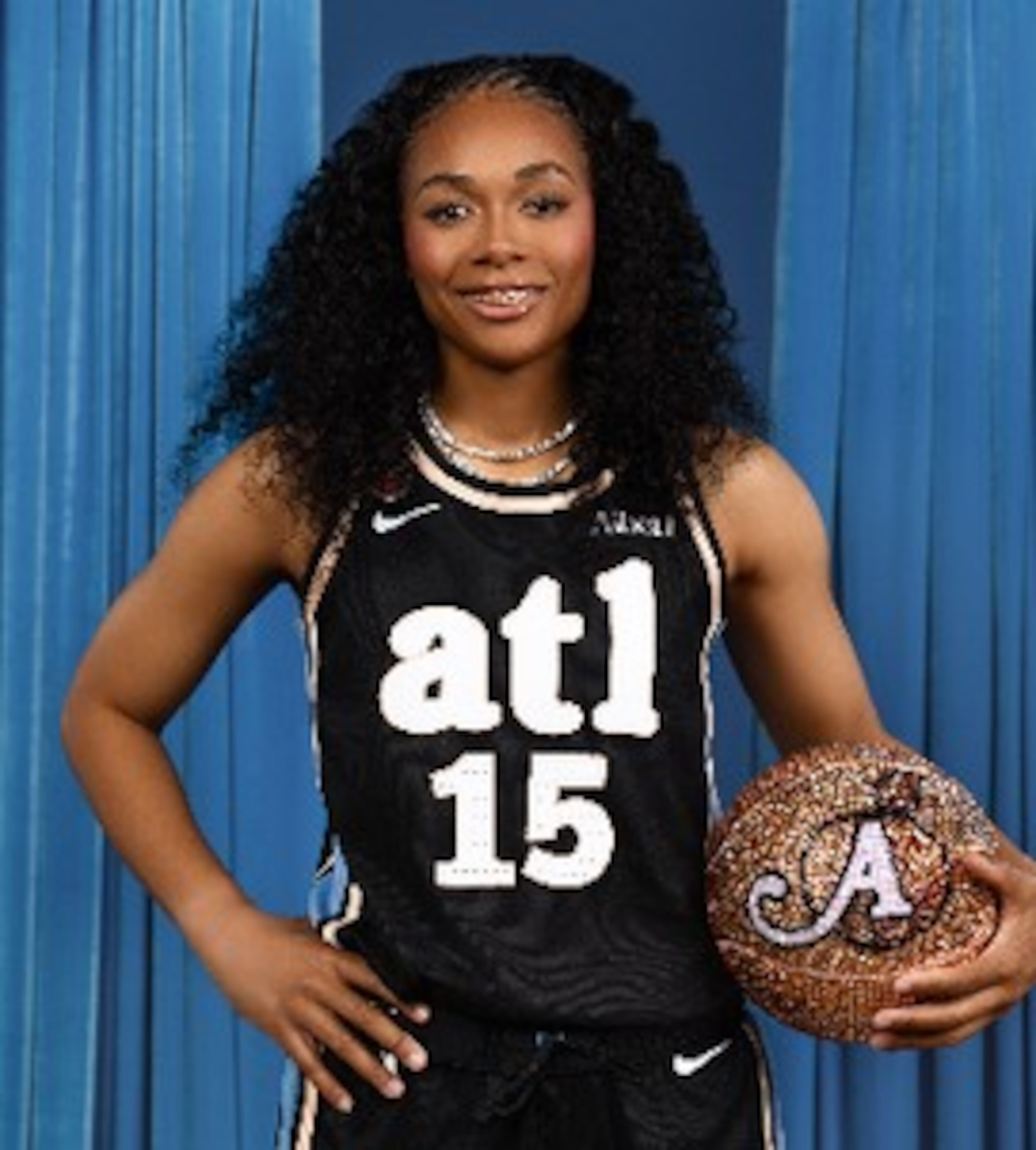 Allisha Gray models the new Atlanta Dream jerseys.