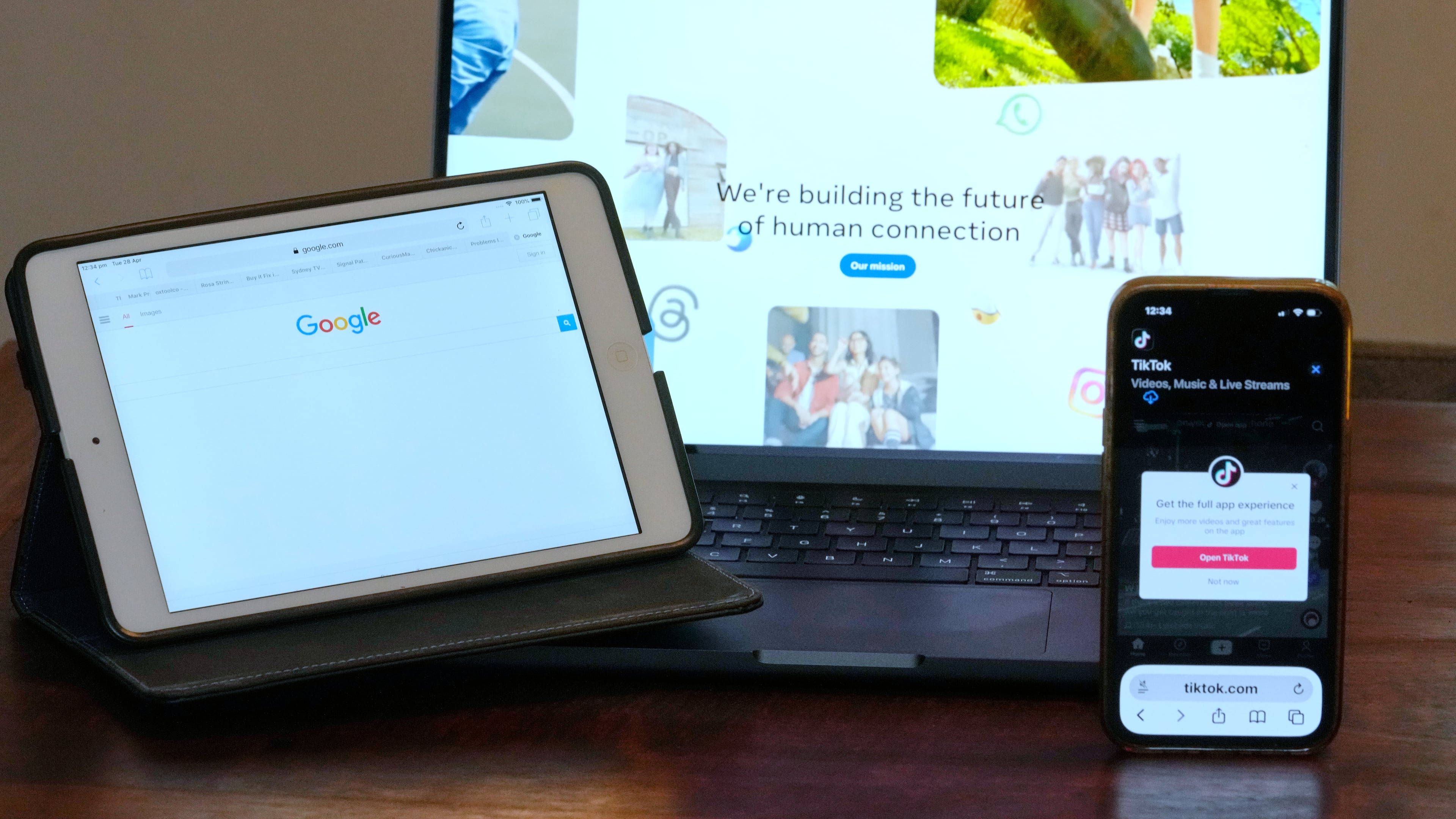 The home pages of Meta, Google and TikTok are displayed on devices in Sydney, Tuesday, April 28, 2026. (AP Photo/Rick Rycroft)